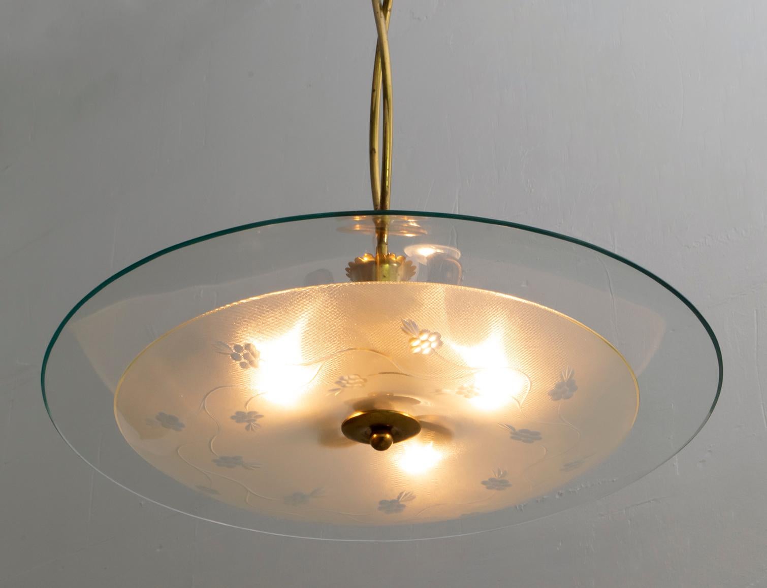 This midcentury glass and brass chandelier was designed by Pietro Chiesa for Fontana Arte in the 1940s.

The Italian Art Deco designer Pietro Chiesa was born in Milan in 1892 in a family of artists originally from Ticino, Switzerland. After his
