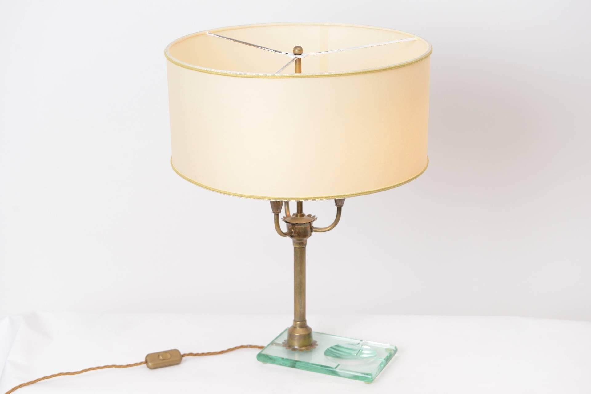 Italian table light in brass and glass with parchment shade.