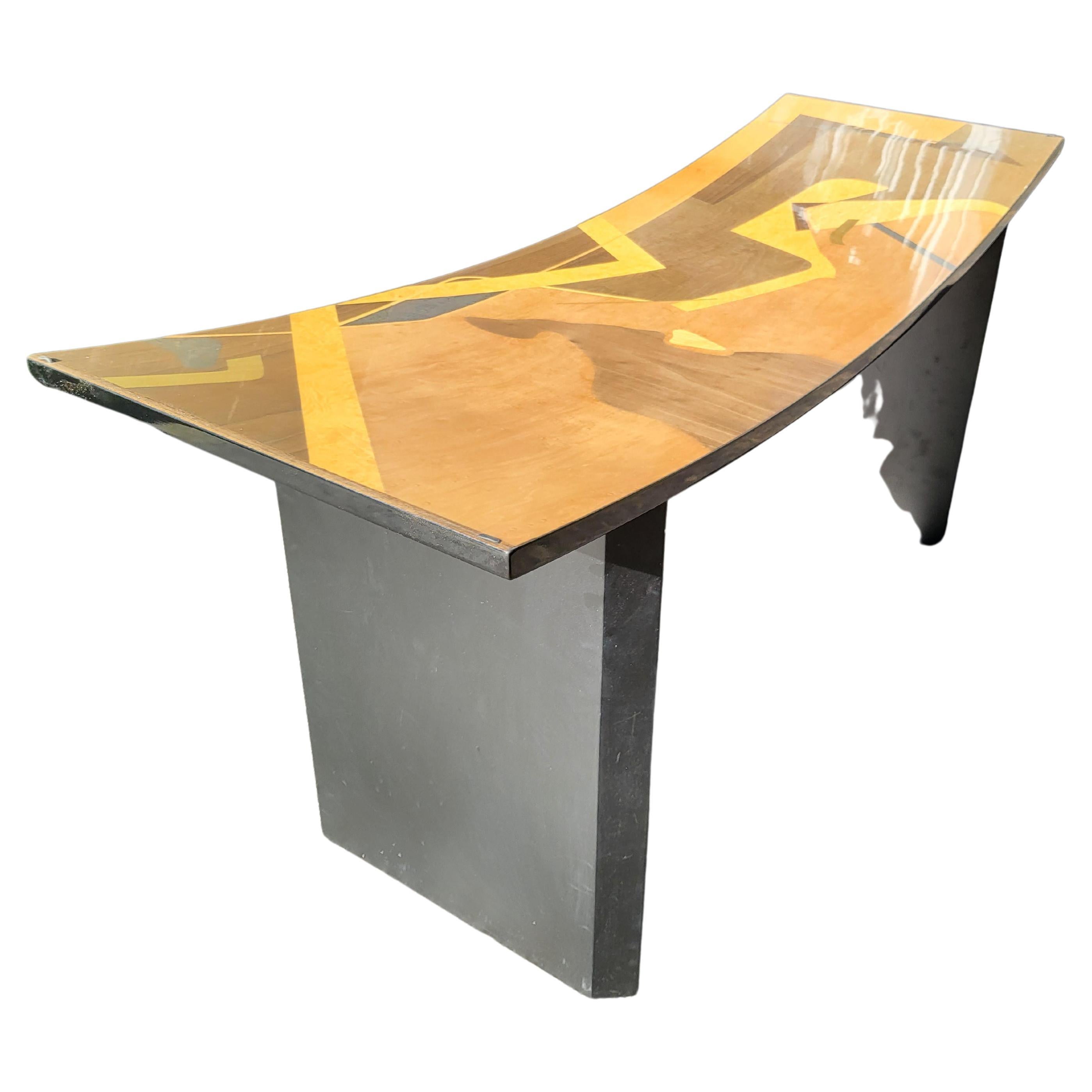 Italian Postmodern dining table signed Pietro Constantini. Concave curved rectangle base on straight panel legs. black Lacquered abstract veneer inlay with geometric designs in colors. Very unique 3/4 inch curved and tapered glass top with rounded