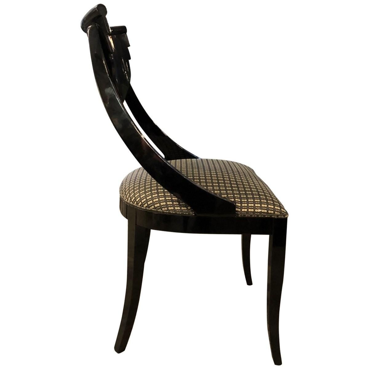 Pietro Costantini was founded in 1922, establishing itself as a leading company in the manufacturing and design of furniture with a timeless aesthetic. These Gondola style dining chairs are constructed with black lacquered wood frames with black,