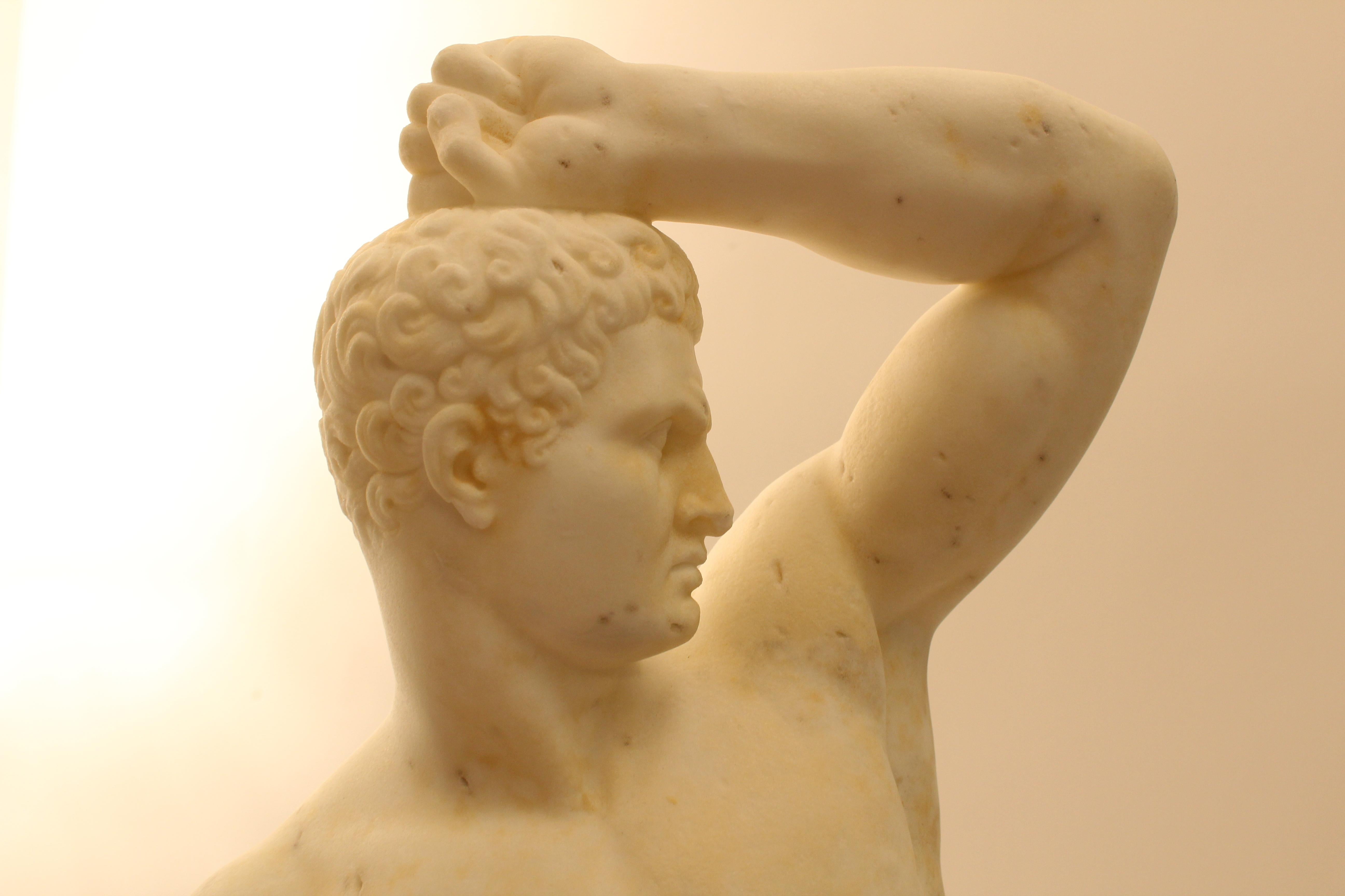 A white marble classical nude male figure, posed with an arm raised to the forehead, the other arm missing. The stance wide, with a trunk carved the base of the figure. Signed “P Franchi S” to the base for Pietro Franchi (1817-1878). After the