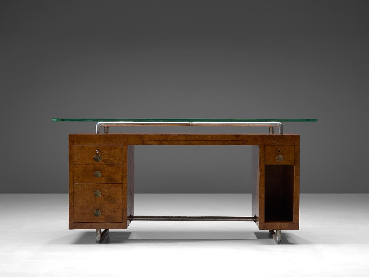 Pietro Lingeri, desk, briar root veneer, glass, brass and metal, Italy, 1930s.

This rationalist desk is designed by the Italian architect Pietro Lingeri. As can be seen in this chunky, strong piece, Lingeri wasn't shy to use innovative materials