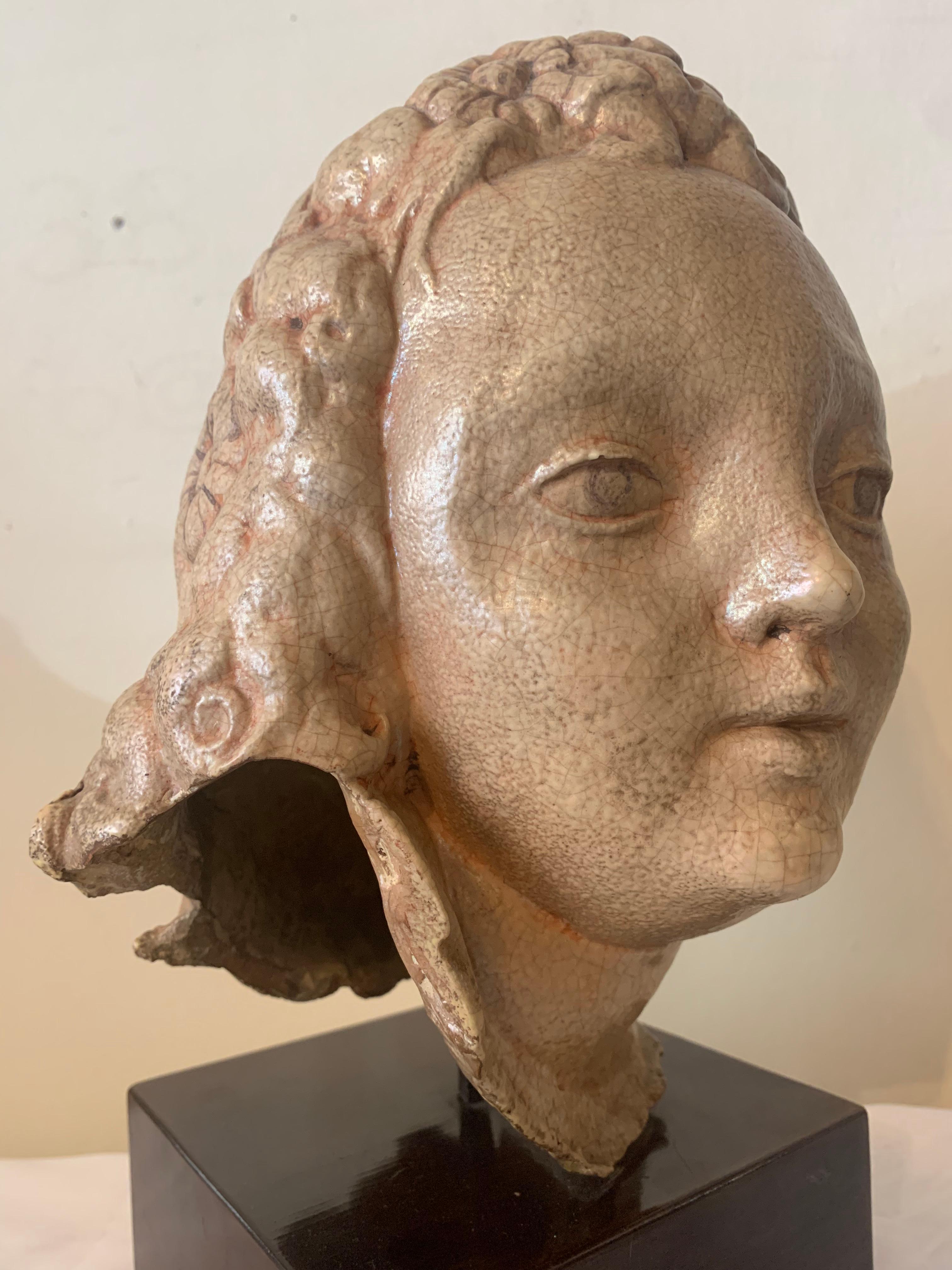 Ceramic head of a young girl, version from the 1960s.

Pietro Melandri, Faenza (1885-1976). One of the most known experimental ceramic Artist, influenced by estetics of Art Nouveau and Art Deco. 

During his artistic career, Pietro Melandi created