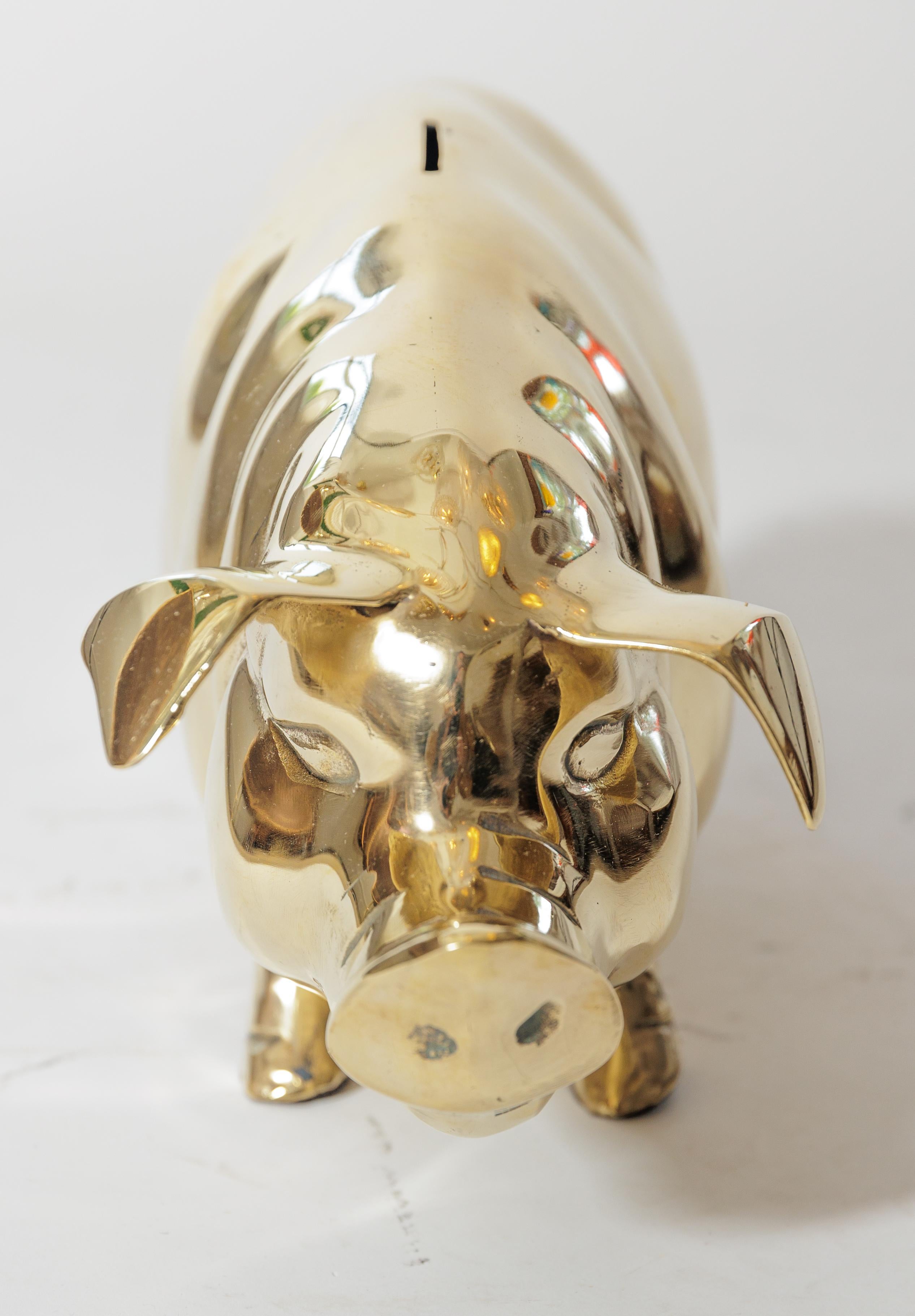 A lovely brass pig to store your monies in.