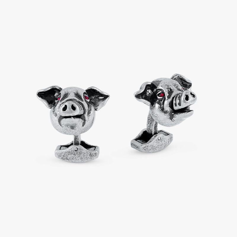 Pig mechanical cufflinks with red Swarovski elements

Our quirky Pig cufflinks incorporate movement found in the real life animal. The snout and ears move by touch and a subtle sparkle of red-coloured Swarovski elements are found in the eyes to