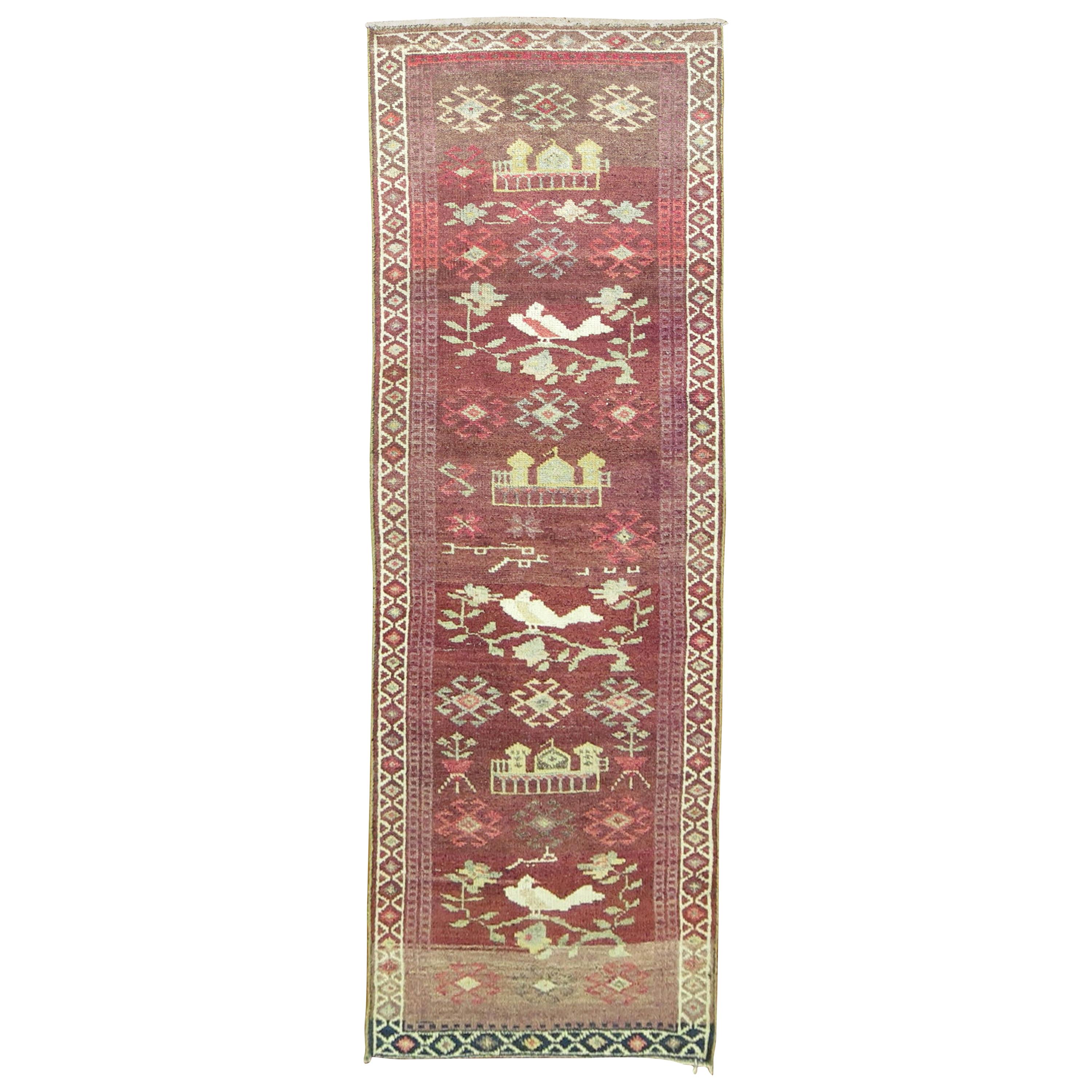 Turkish Anatolian runner featuring three white pigeons on a plum-colored field.

Measures: 3'1'' x 11'3''.