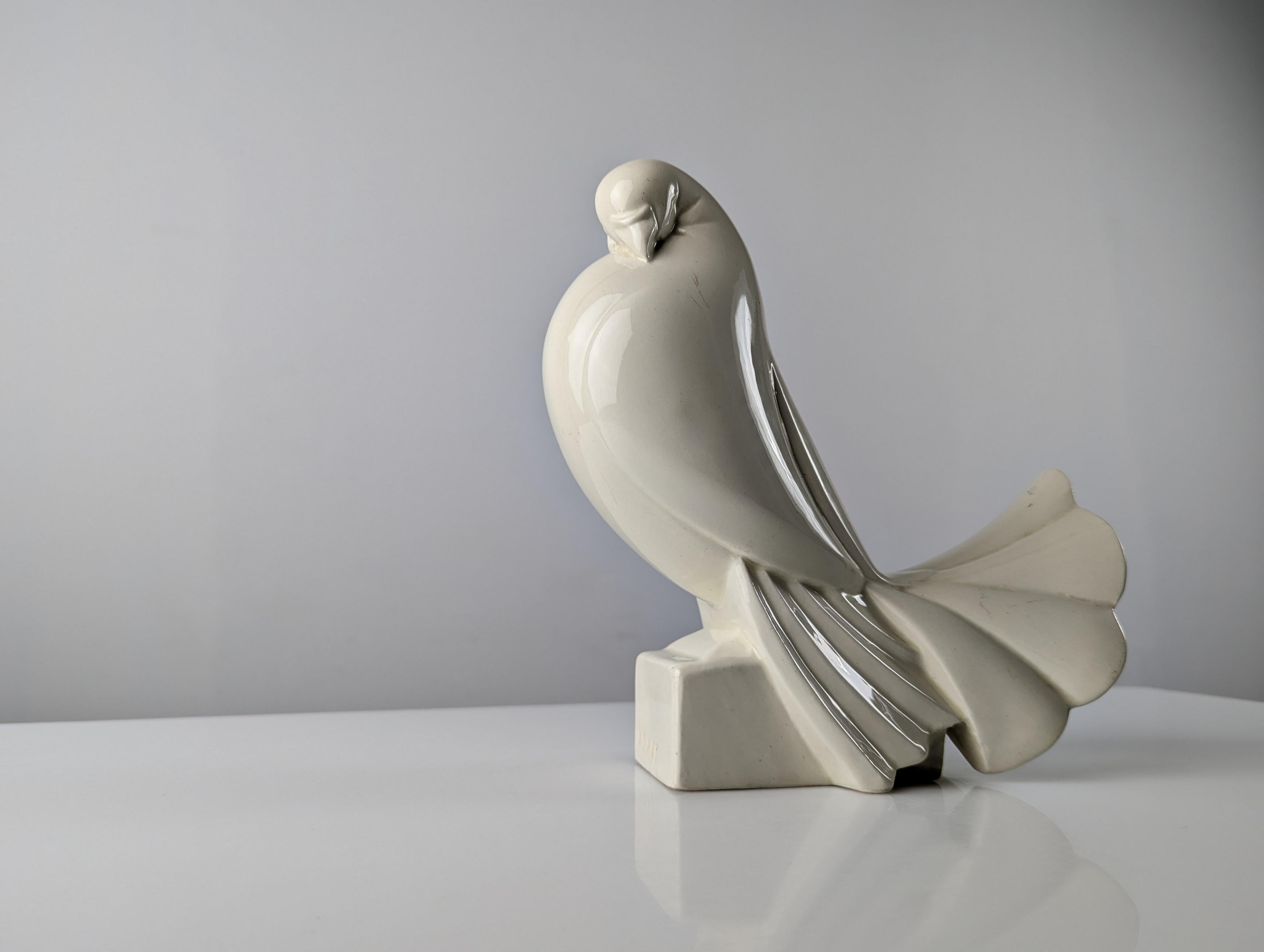 Extraordinary ceramic dove by the renowned French artist and designer Jacques Adnet and exhibited for the first time at the 1925 International Exhibition of Decorative Arts and Modern Industries in Paris, specifically in the ladies' room of La