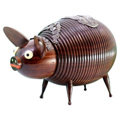 Piggy bank in rosewood shape in the shape of a pig with silver applications