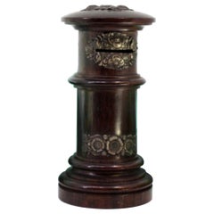 Piggy bank in rosewood shaped like a post box with silver applications