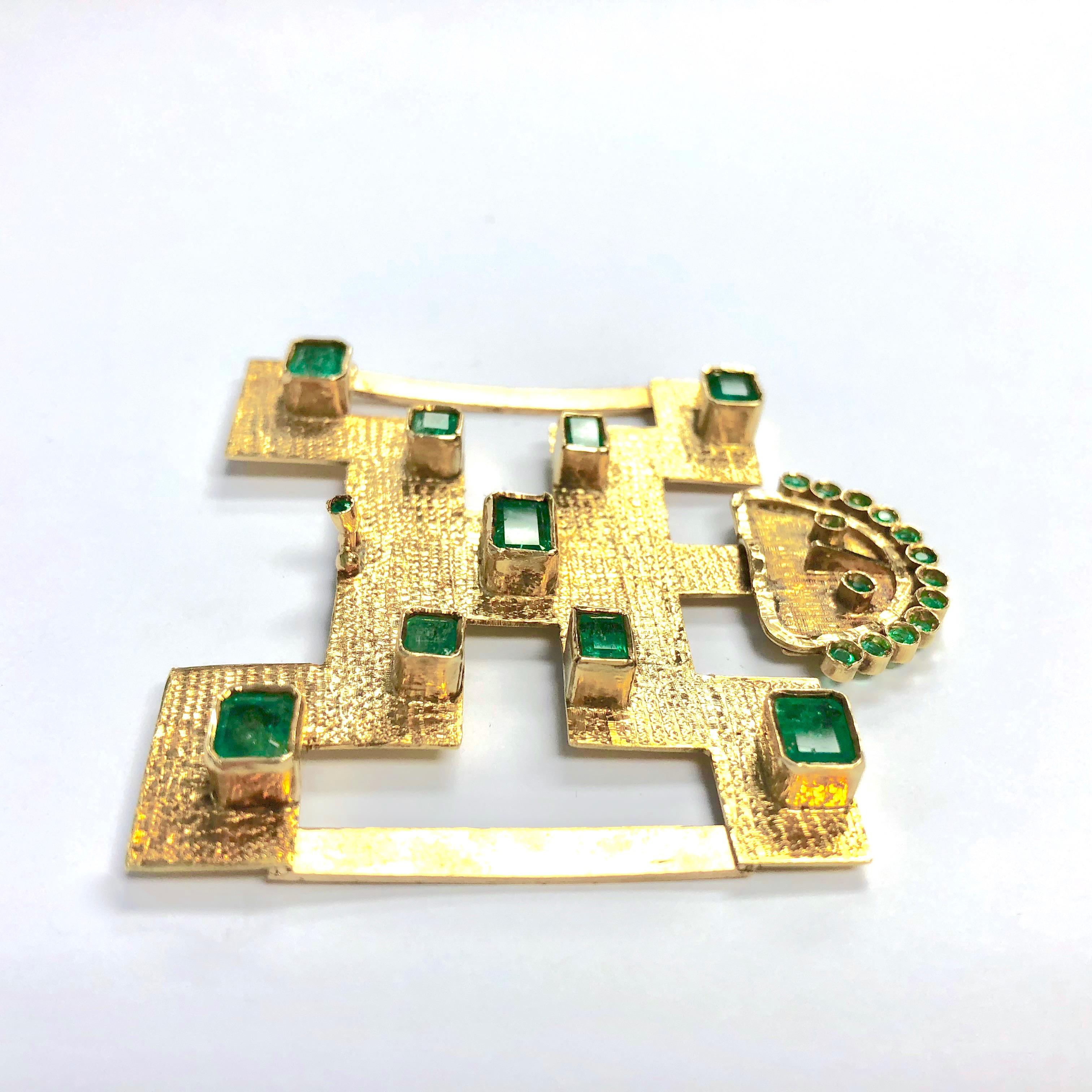 Amazing 18K yellow gold hand crafted belt buckle set with twenty-four bezel set round and rectangular step cut emeralds. Approximate total emerlad weight: 8.0 carats. (The Pijao or Pijaos formed a loose federation of Amerindians and were living in