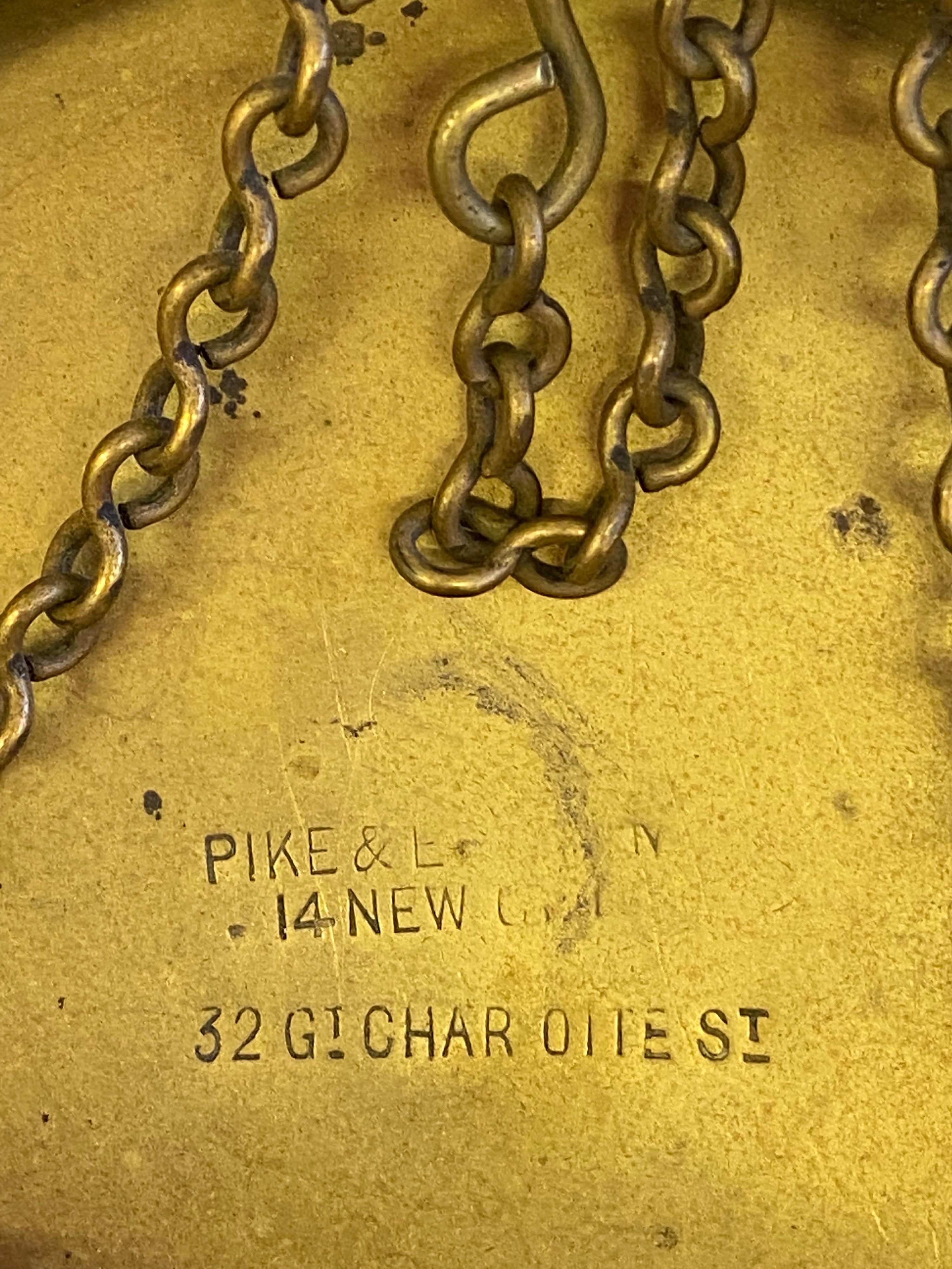 Pike and Elliman brass shop scale, dating to the 1880's. Nice original condition. Class b to weigh up to 12oz. Stamped on brass tray pike & E 14 new, 32 Gi char oite st. Sits on original wood base.