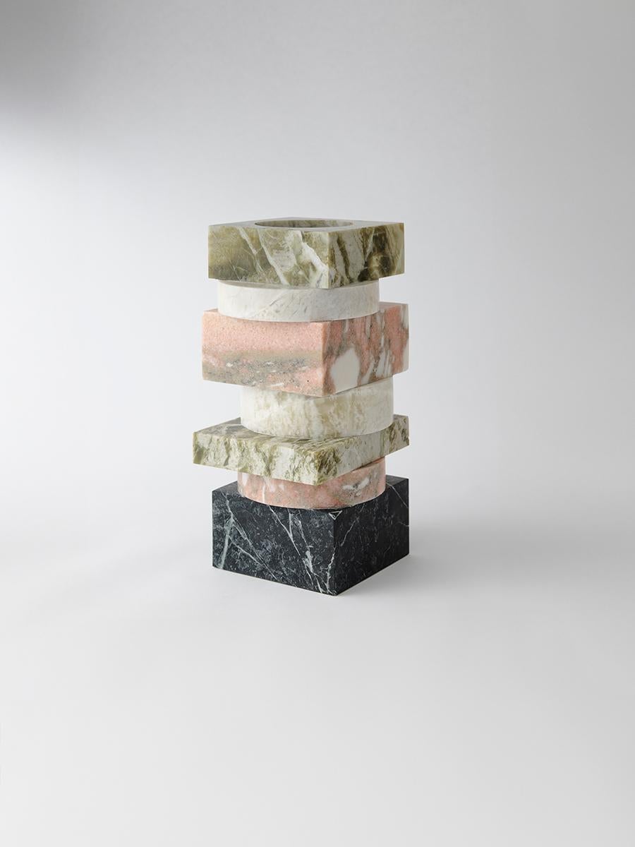 To juxtapose marble’s natural veining, the Pila Vase references the work of modernist architect Paul Rudolph. Reflecting the tension between built and organic forms in contemporary design, this stacked vase showcases a tonal mix of different natural