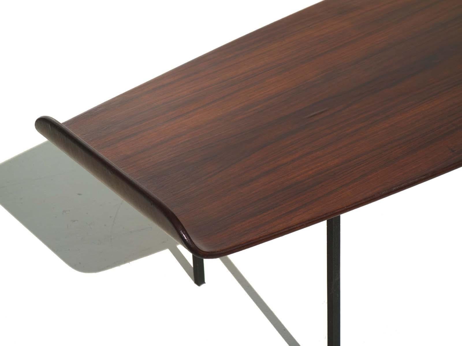 Bent plywood with teak veneer 
Black embossed metal legs.