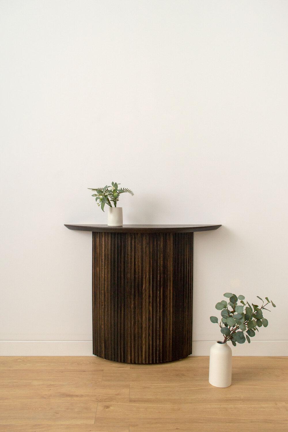 Pilar Demilune console table by Indo Made
One of a kind
Dimensions: L 106.7 x D 30.5 x H 91.4 cm
Materials: Oxidized oak.

Also available in different Oak and Maple finishes; and with a hardwood or stone top. Please contact us.
Each piece is