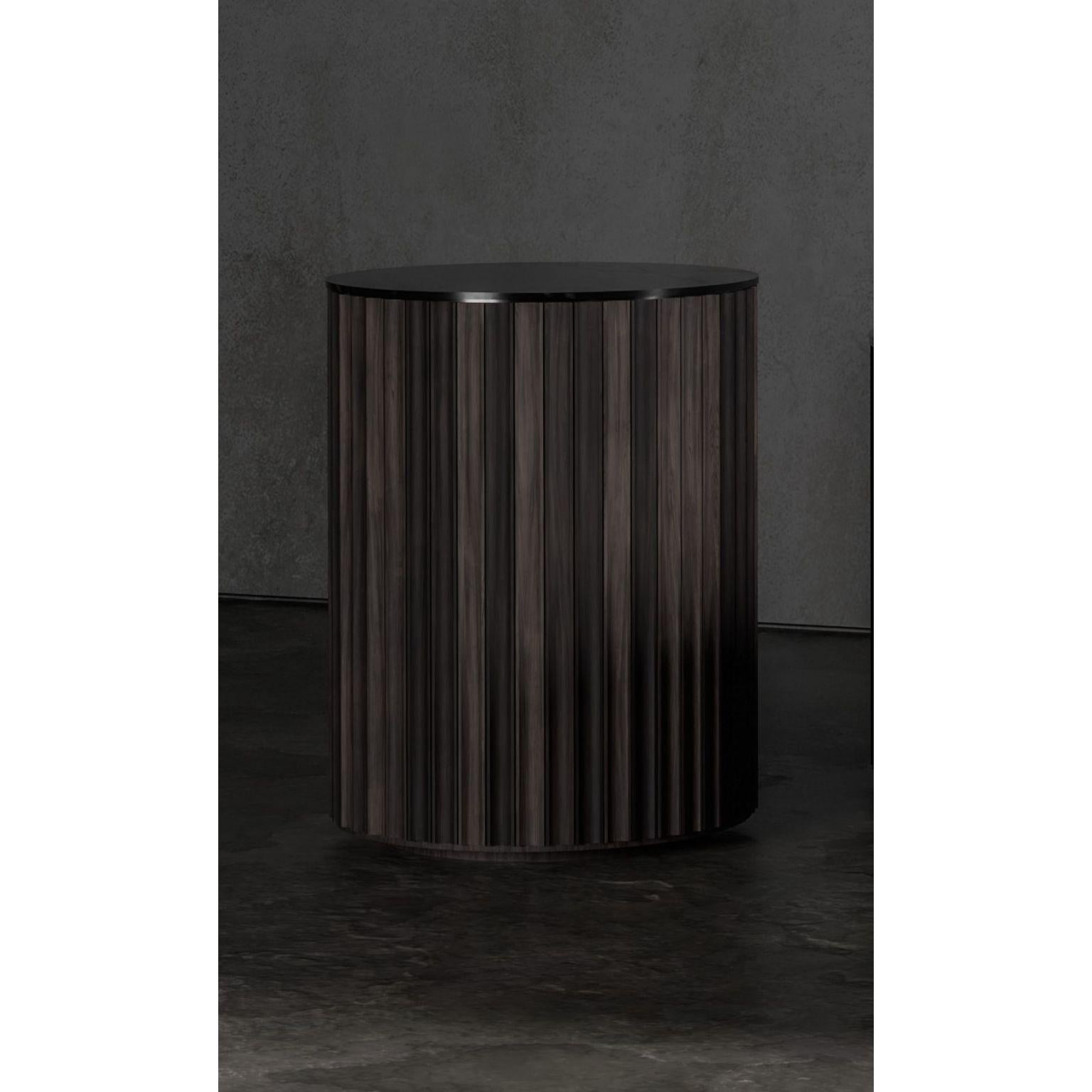 Pilar end table by Indo Made
One of a kind.
Dimensions: Ø40.6 X H53.3 cm 
Materials: oxidized oak, Nero Marquina Marble top.

Also available in other materials and finishes. 
Each piece is carefully handcrafted by our team using natural