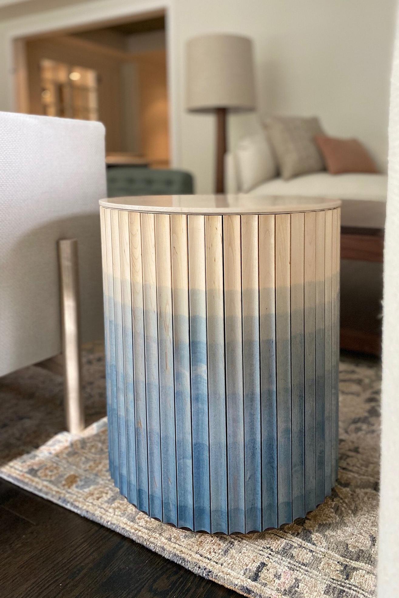 Pilar end table by Indo Made
One of a kind.
Dimensions: Ø40.6 X H53.3 cm 
Materials: Maple with Cobalt Blue ombre finish, Crema Marfil marble top.
Also available in other materials and finishes. 

Each piece is carefully handcrafted by our
