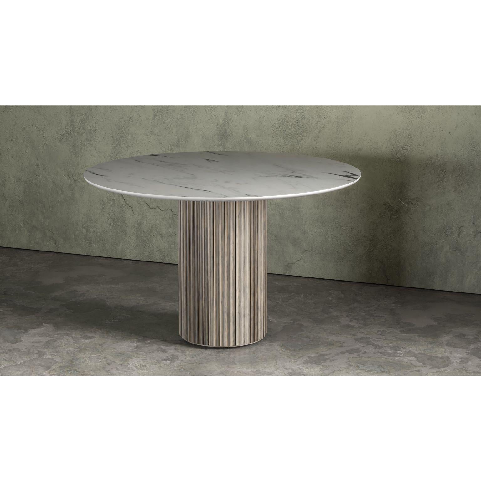 Pilar round dining table by Indo Made
One of a kind.
Dimensions: Ø122 X 76.2 cm 
Materials: Oxidized Maple, White Carrara marble top.

Also available in other materials and finishes. 
Each piece is carefully handcrafted by our team using
