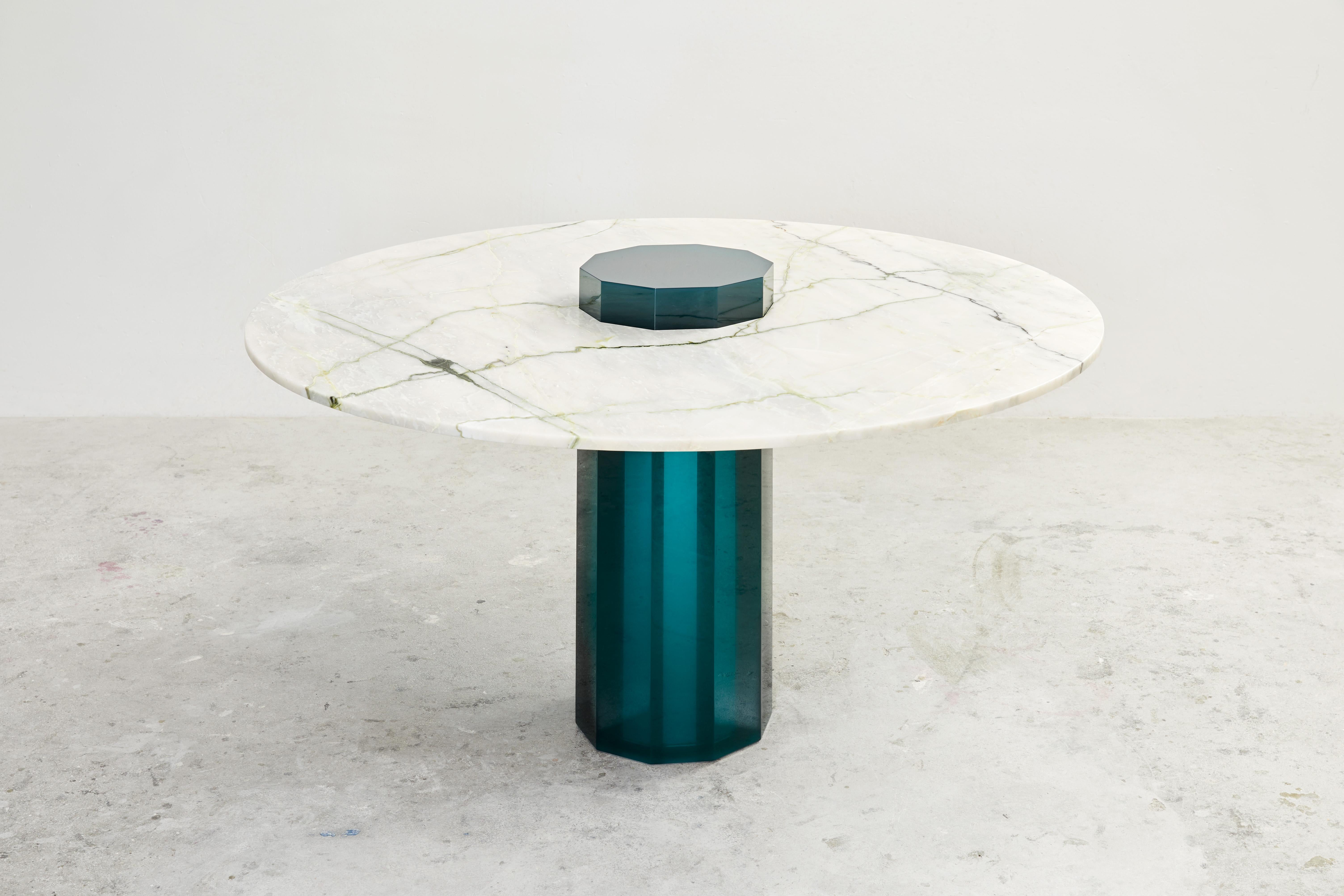 Pilastro dining table by Cobra Studios
Dimensions: 150 x 75 cm
Materials: Resin, Finish 
Tabletop: Marble Lillac.

Finish tabletop: Travertine available
 
SOLIDS Collection 
The solids collection is a family of dinner tables, coffee tables,