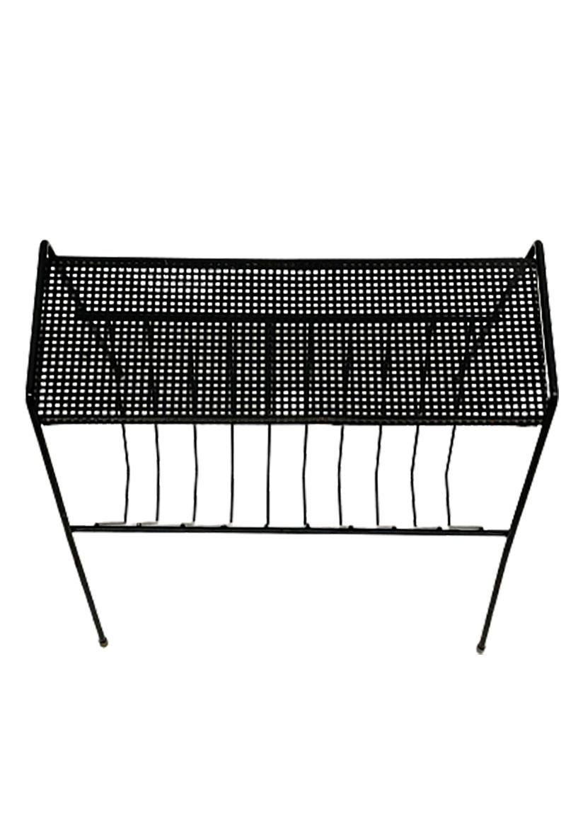 Pilastro metal magazine rack with perforated small table top

A Dutch design, black lacquered frame with perforated small table top magazine rack
Mid 20th century

The measurements are 44 cm high and 40 cm wide
The depth is 31,5 cm
The weight