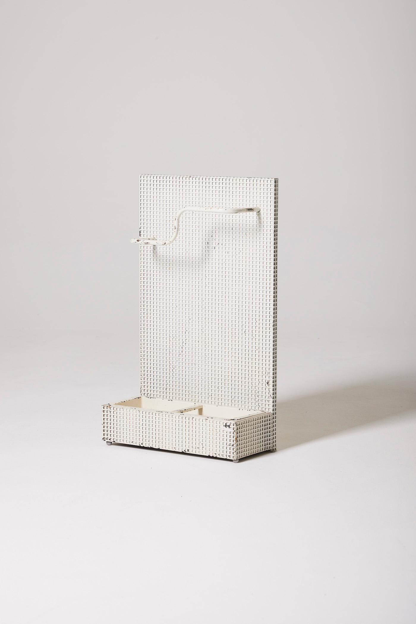 Umbrella Stand by designer Tjerk Reijenga for Pilastro, 1960s. It is in perforated white metal in the style of designer Josef Hoffmann. Time-worn patina.
DV457