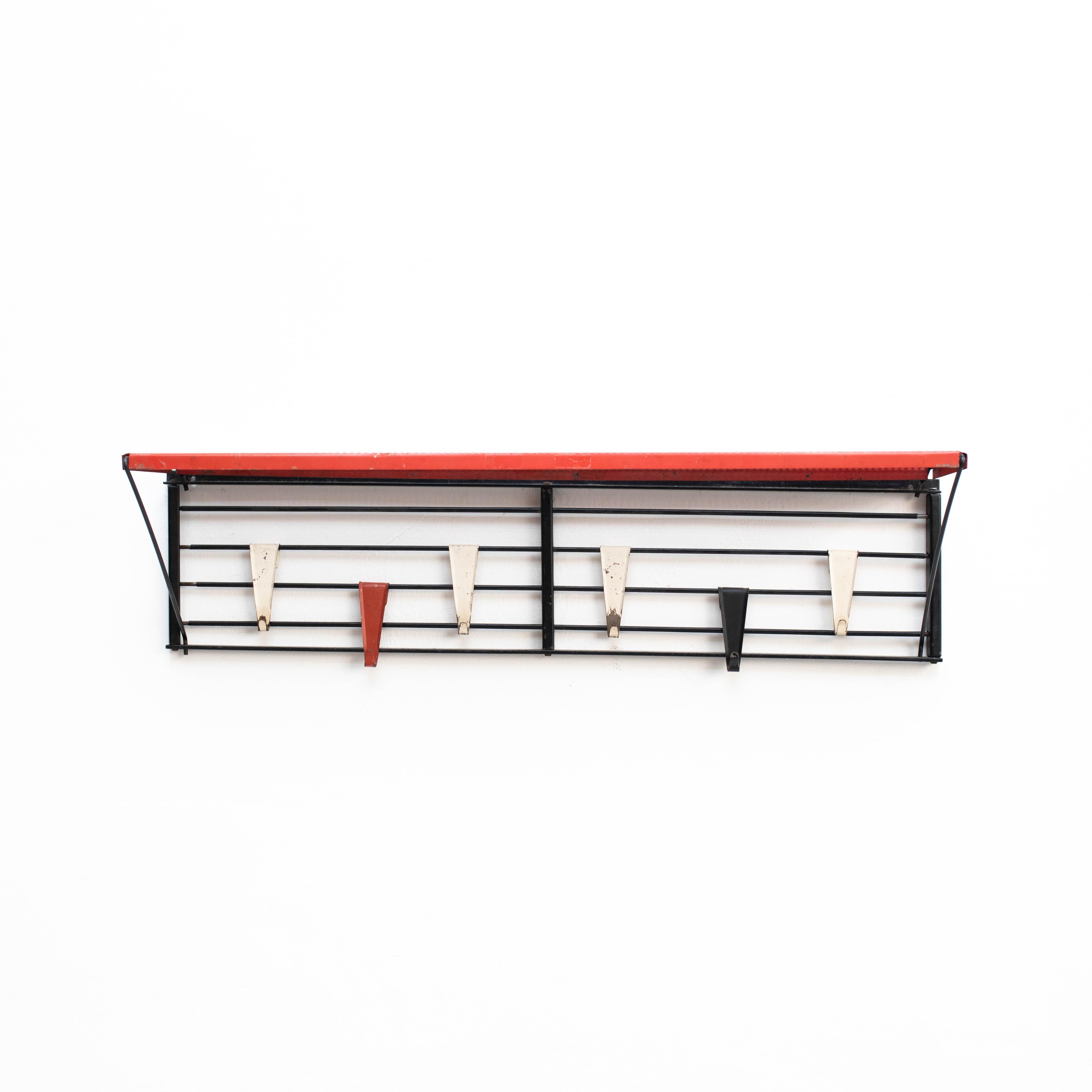 Metal shelving designed by Tjerk Reijenga and manufactured by Pilastro.
Holland 1950.

In original condition, with minor wear consistent with age and use, preserving a beautiful patina.

Materials:
Metal 

Dimensions:
H 23cm 
W 88cm
D