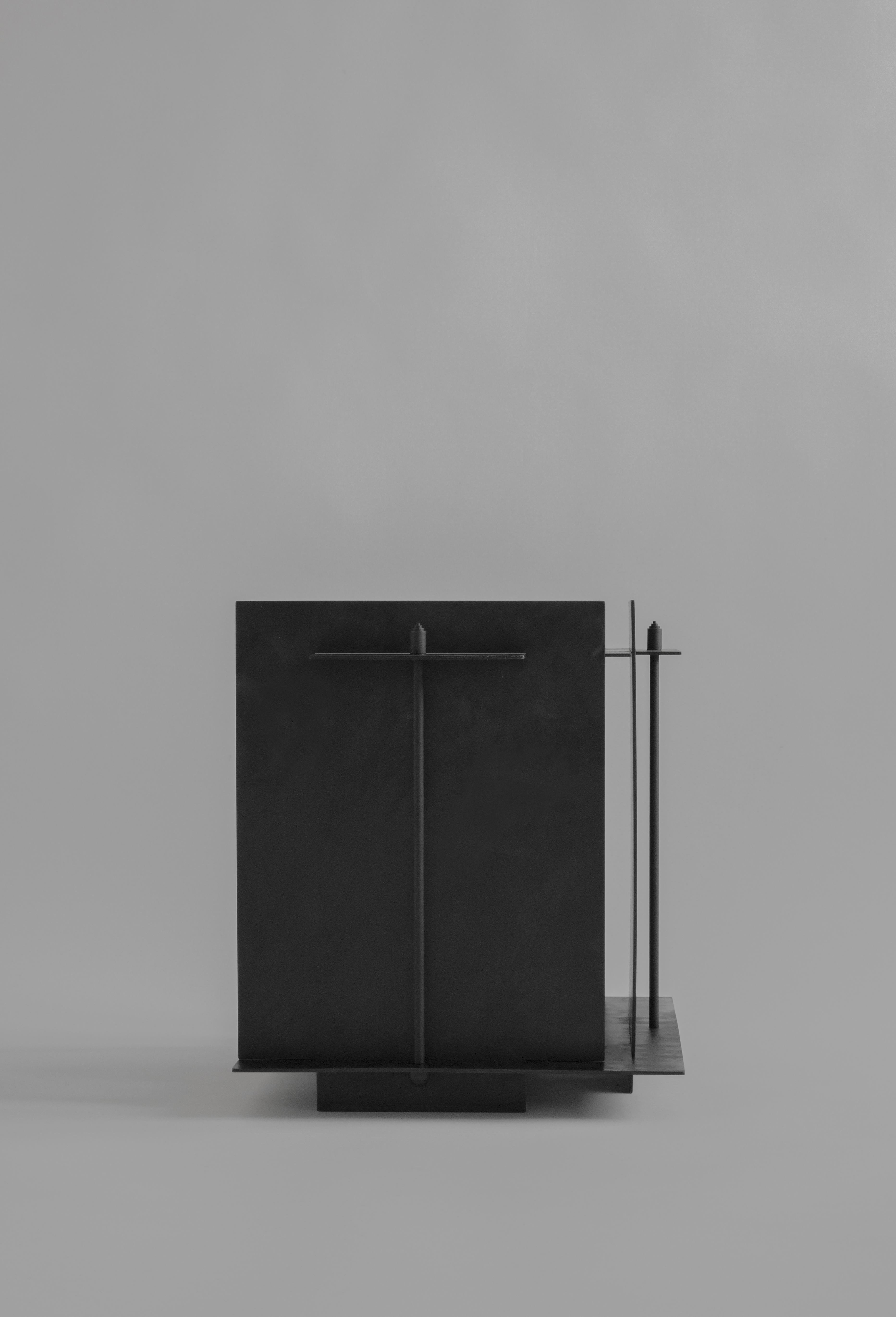 Pilier side table by Sizar Alexis
Signed and Numered
Edition of 12
Dimensions: Length 40 x width 34 x height 39 cm
Materials: Blackened steel
Weight: ~ 15kg  

A series of boldly sculpted furnitures and objects, an
appreciation of the raw