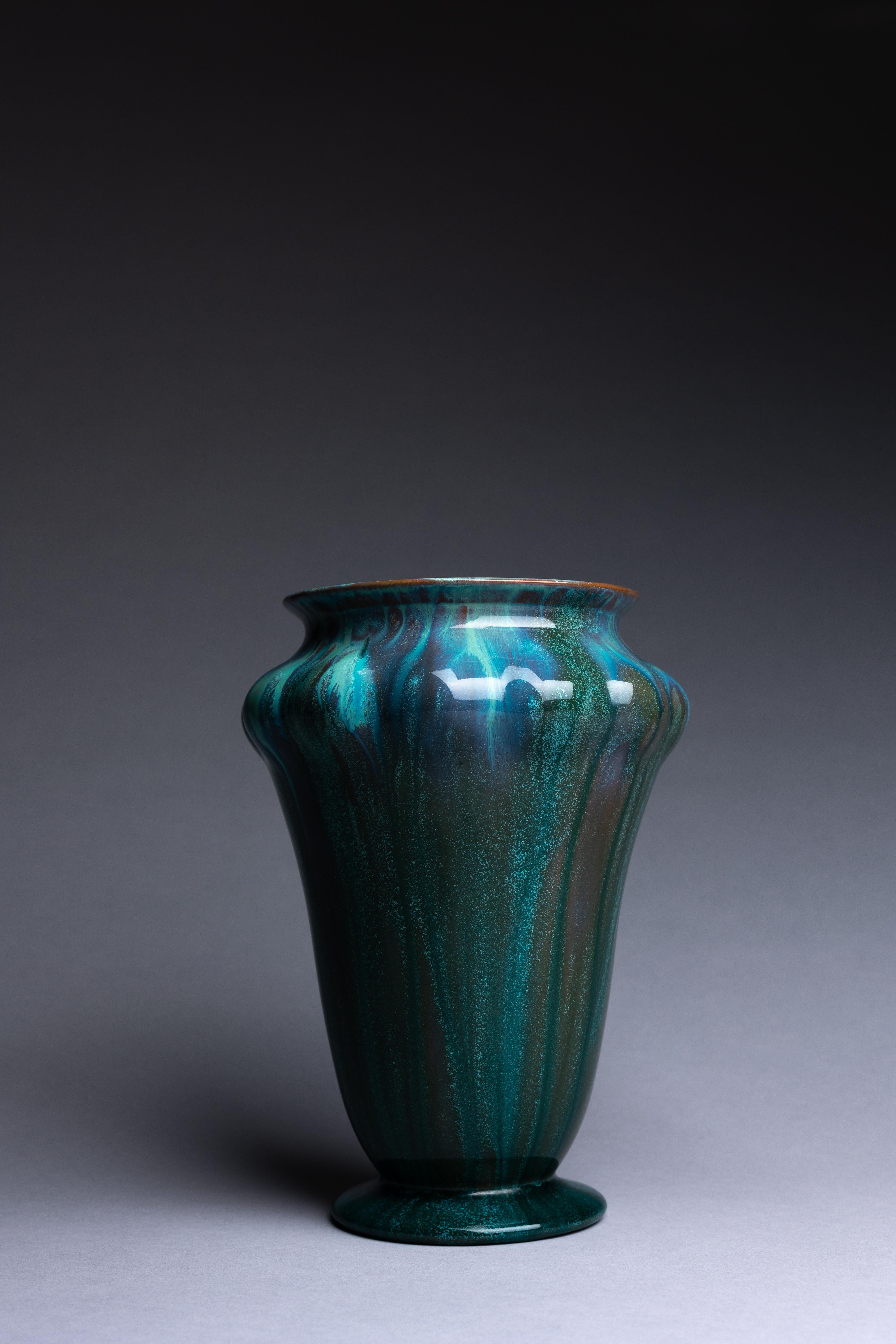 A Pilkingtons pottery vase with a gorgeous blue crystalline glaze, created in 1913. This vase is a fine example of Pilkington’s studio art pottery.

The stunning effects of Pilkington’s crystalline glaze are on full display in this large vase. The