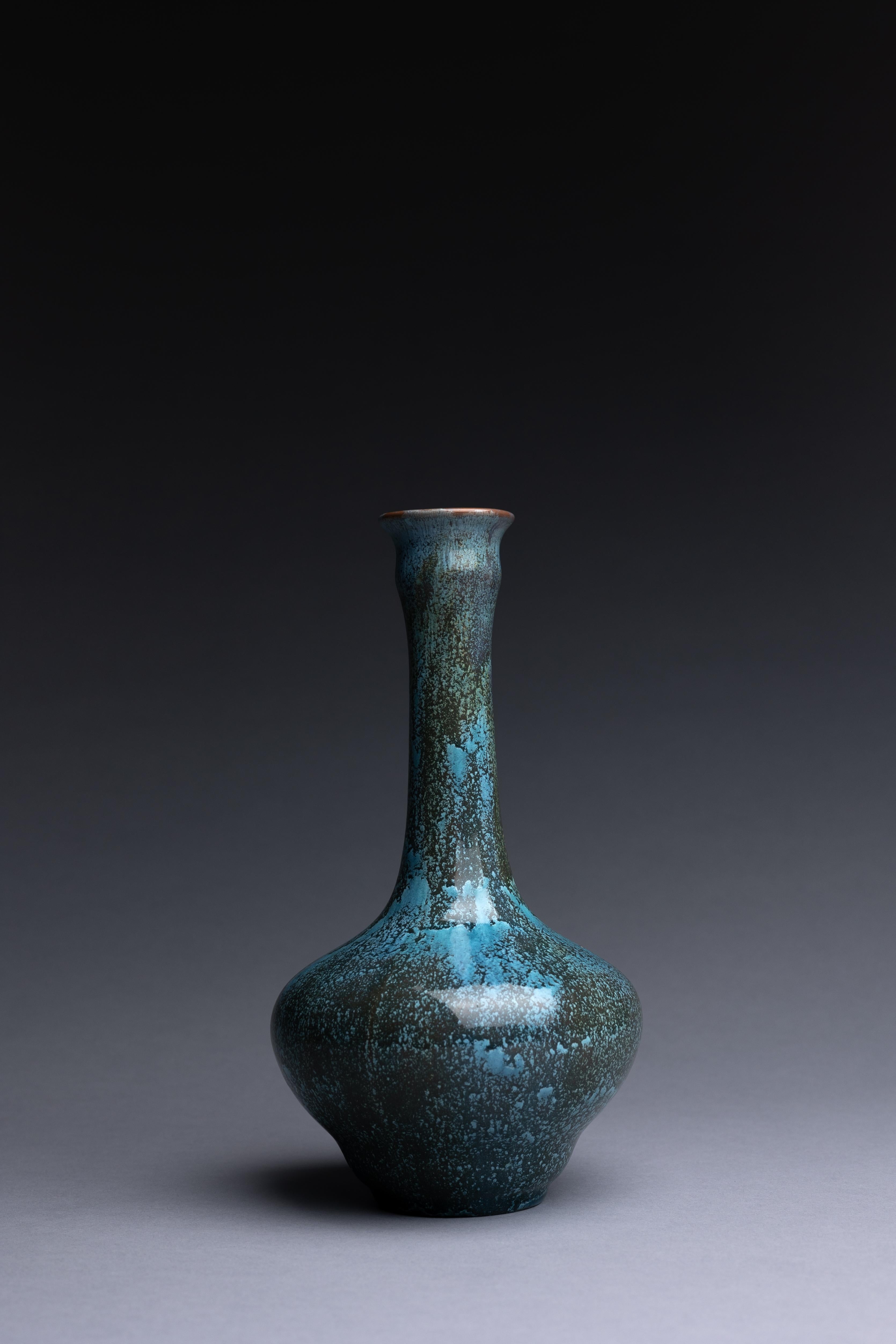 An art pottery vase made by Pilkingtons with a blue crystalline glaze, created circa 1910. This vase is a fine example of Pilkington’s studio art pottery.

Pilkington’s monochrome-glazed art pottery celebrates the company’s innovations in artistic