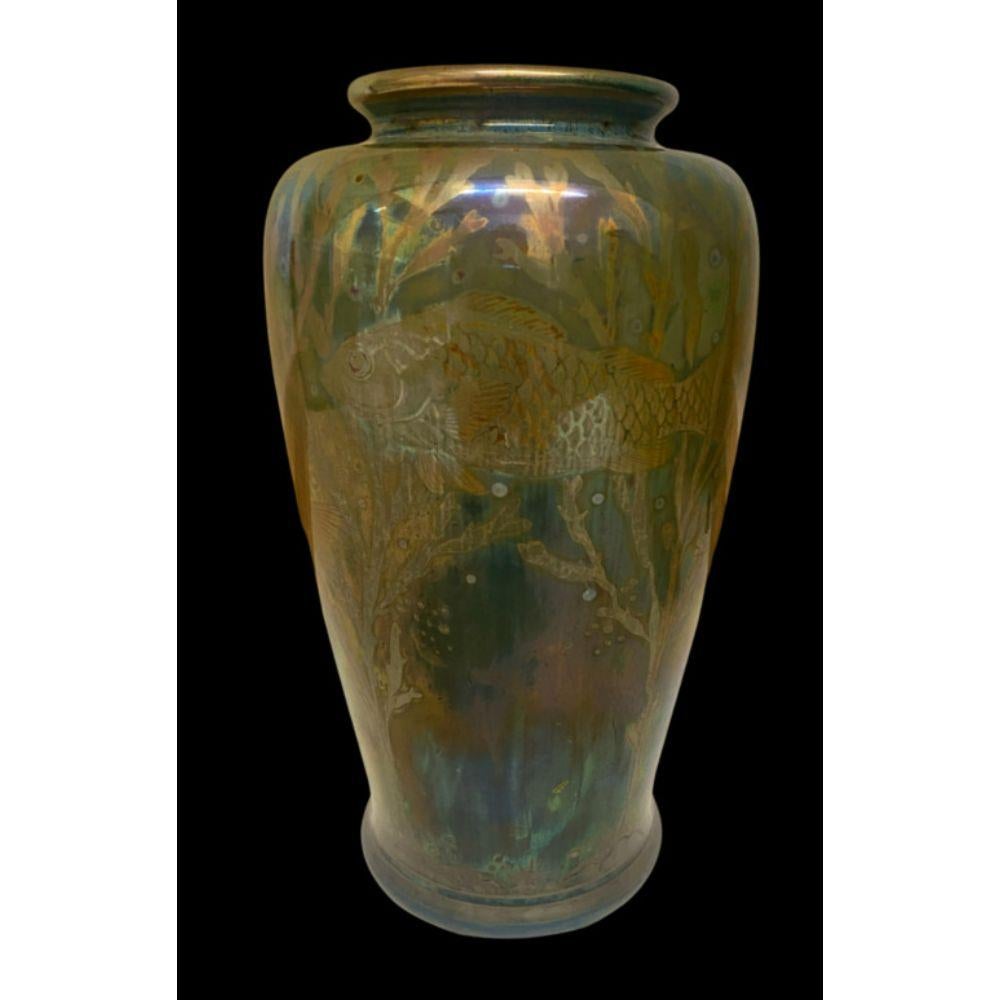 Pilkington's Royal Lancastrian Lustre Vase decorated with Fish by Richard Joyce

Date cypher for 1911

Dimensions: 22.5cm high, 12cm wide

Complimentary Insured Postage
14 Day Money Back Guarantee
BADA Member – Buy the Best from the Best