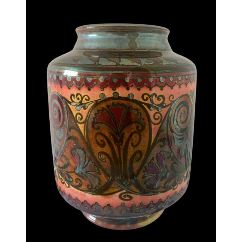 Pilkington's Lustre vase decorated with stylised owl’s face, carnations and hearts by William Mycock Dated 1920

Dimensions: 15.5cm high, 11.5cm wide

Complimentary Insured Postage
14 Day Money Back Guarantee
BADA Member – Buy the Best from
