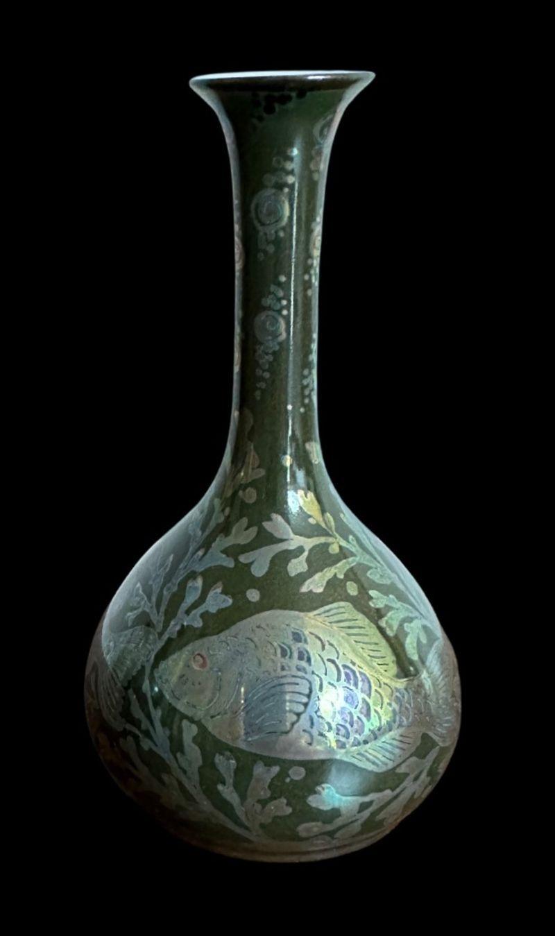 181
Pilkington’s Royal Lancastrian Fish Vase
The Vase with an elegant elongated neck and a strong, even firing, is decorated with fish by Richard Joyce
13.5cm high, 7.5cm wide
Date cypher for 1910
From a private collection