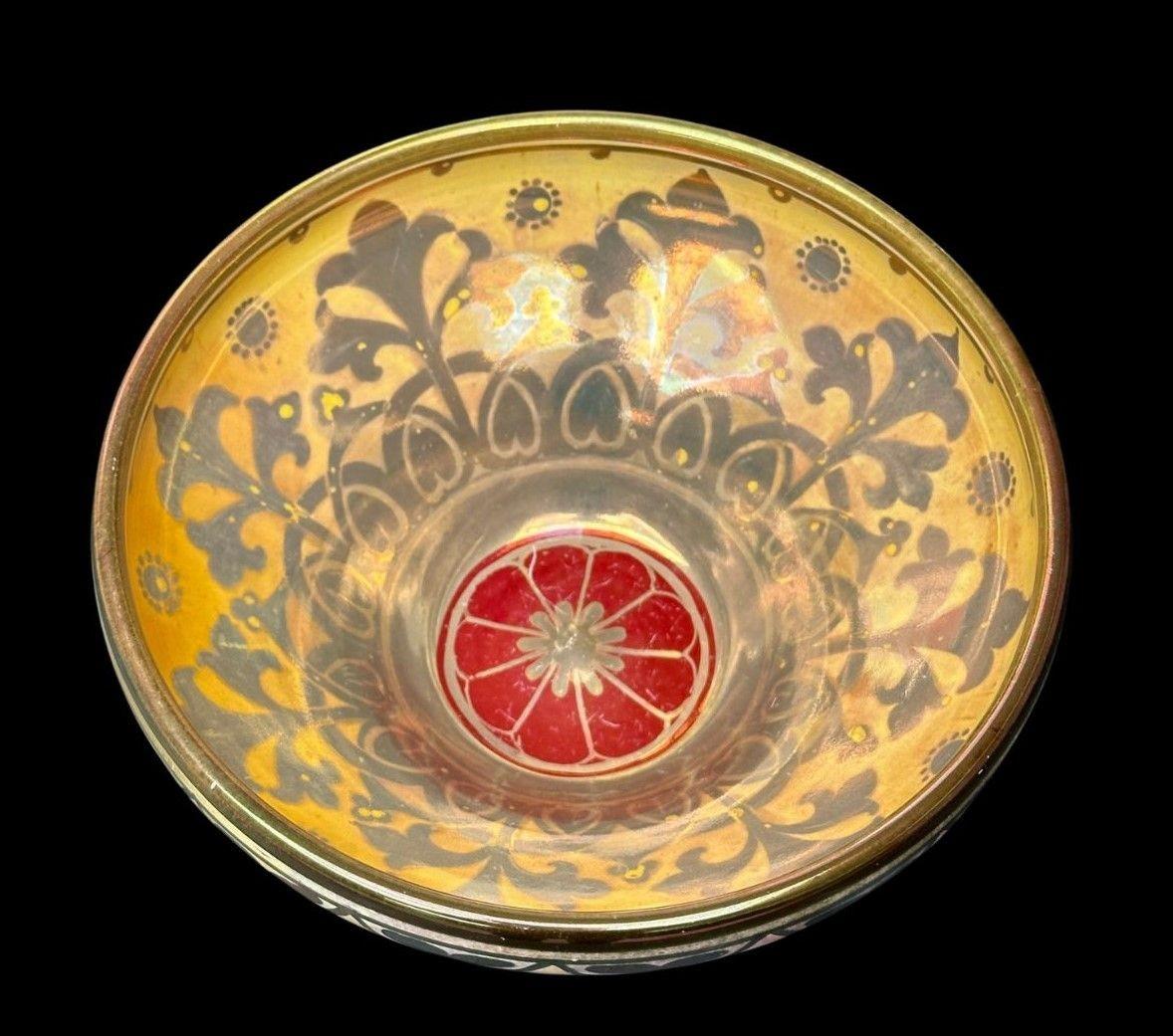 174
Pilkington's Royal Lancastrian Lustre bowl decorated with a central floral rosette with a border of Fleur De Lys, the exterior with Love Hearts.
circa 1914
Measures: 8 cm high, 17 cm wide.