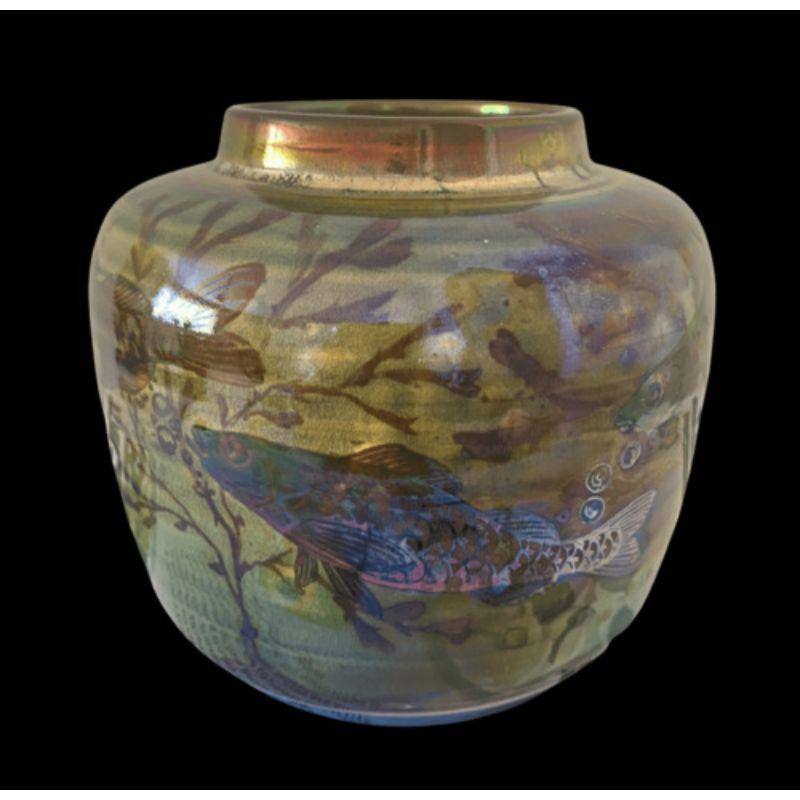 Pilkington's Royal Lancastrian Lustre Vase decorated with Fish by Richard Joyce Date cypher for 1911

Dimensions: 12 cm high, 13 cm wide

Complimentary Insured Postage
14 Day Money Back Guarantee
BADA Member – Buy the Best from the Best