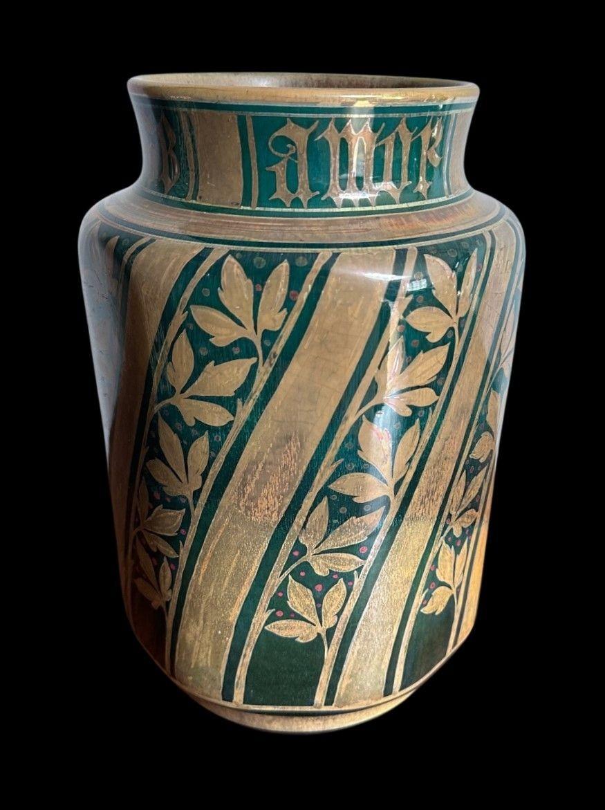 5445
Gordon Forsyth for Pilkington’s Royal Lancastrian, and Octagonal Vase decorated with Leaves and Berries and Latin Script, “Amor Regge Senza Legge”
Measuring 24cm high and 15.5cm wide it bears the date cyper for 1908
* Complimentary Insured