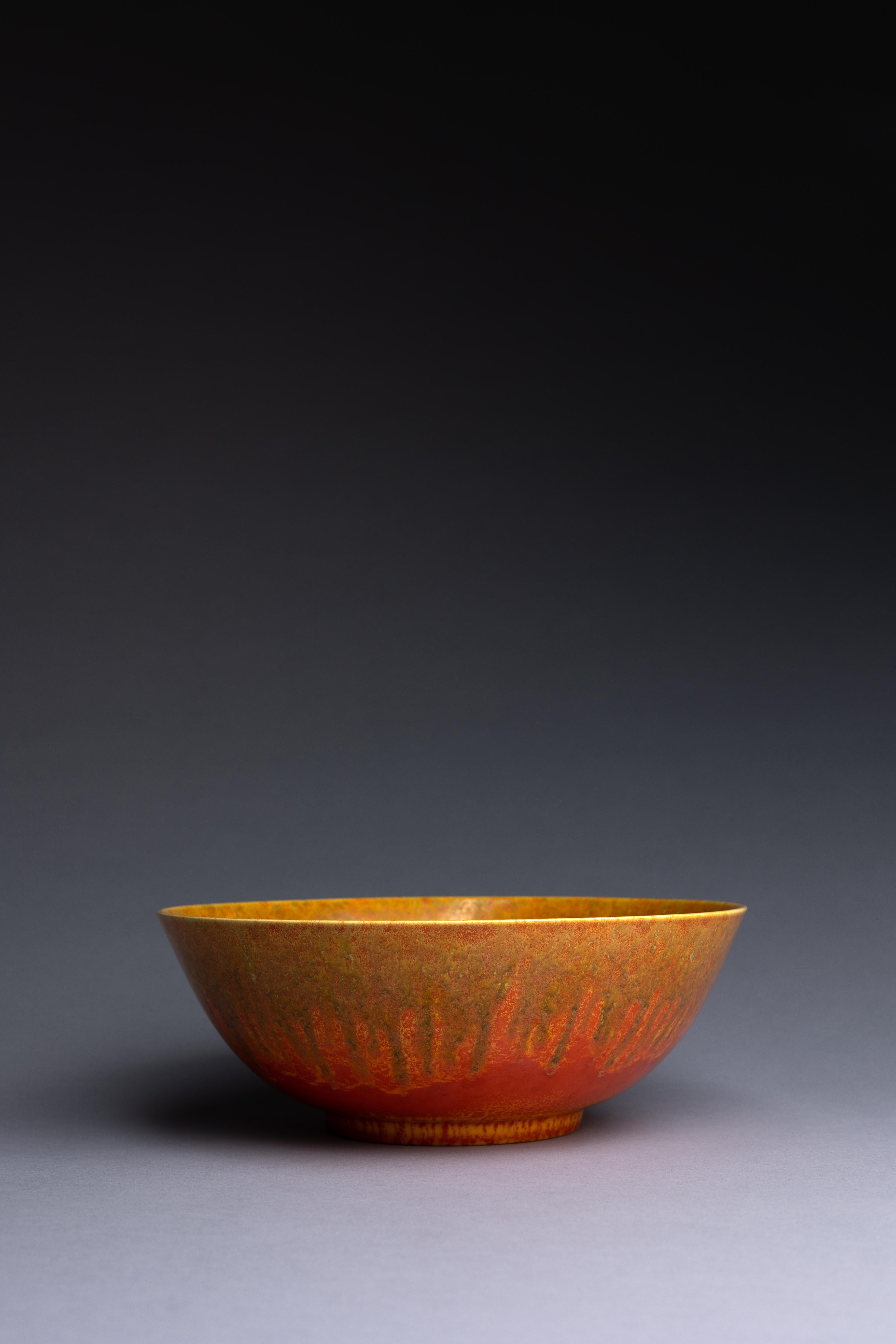 This brilliant orange bowl, created by Pilkingtons circa 1930 is dripping with the company's vermilion glaze. It's a fine example of Pilkington’s studio art pottery.

Pilkington’s vermilion glaze range was created around 1930, near the end of the