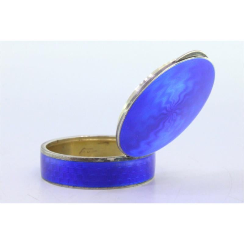 Description: Silver pill box with enamel on the lid and casing and gold interior. Metal: Silver. Origin: Russian. Brand: Unknown. Weight: 49.75 grams. Dimensions: 4.9cmx4.9cm. Content: 935/1000. Assay Mark: Yes. Additional information: Good