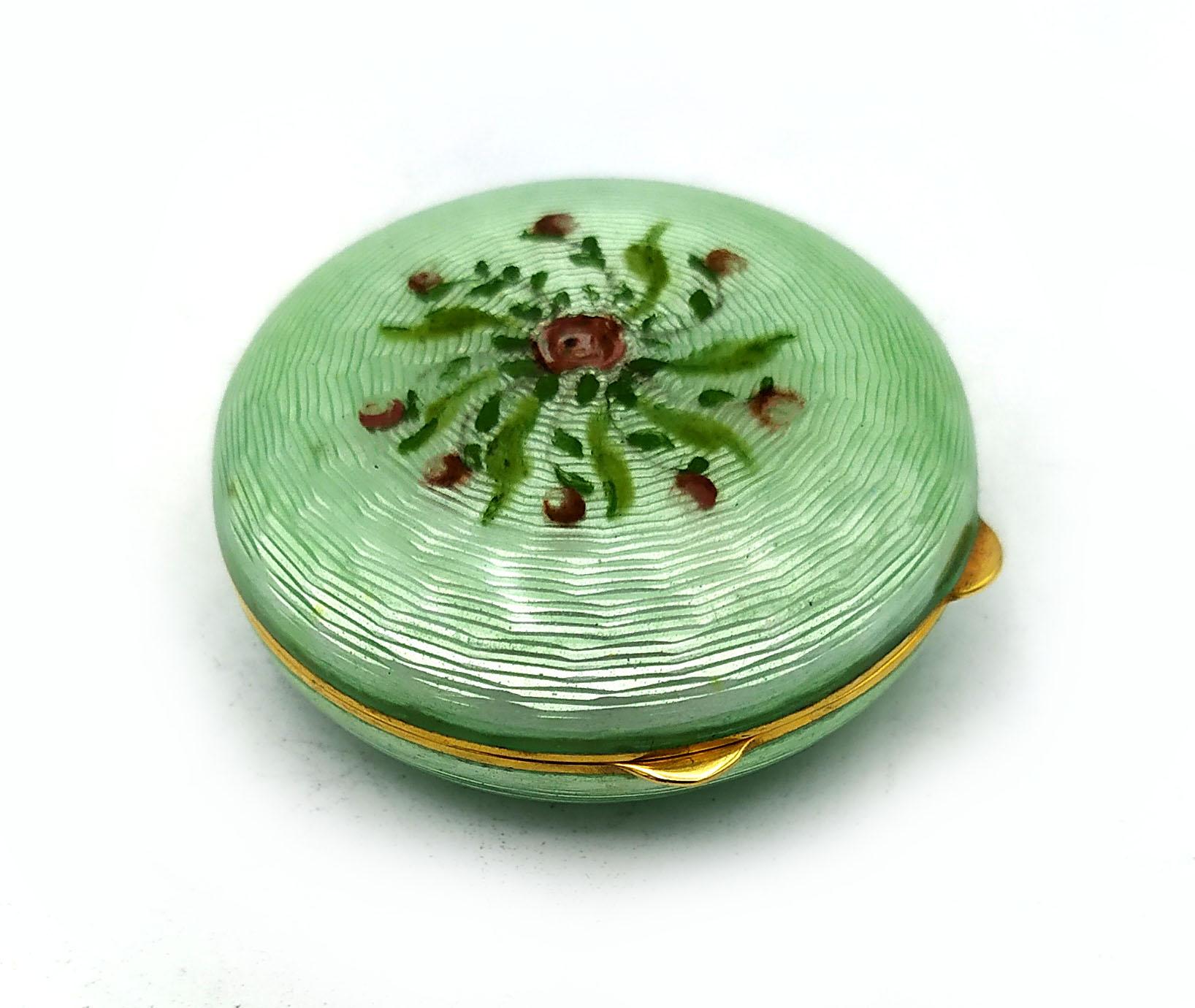 Round domed pill box in 925/1000 sterling silver gold plated with translucent enamel fired on guilloche above and below, and hand-painted floral miniature. Viennese Art Nouveau style, second half of the 19th century. Measurement diameter cm. 4.2 cm