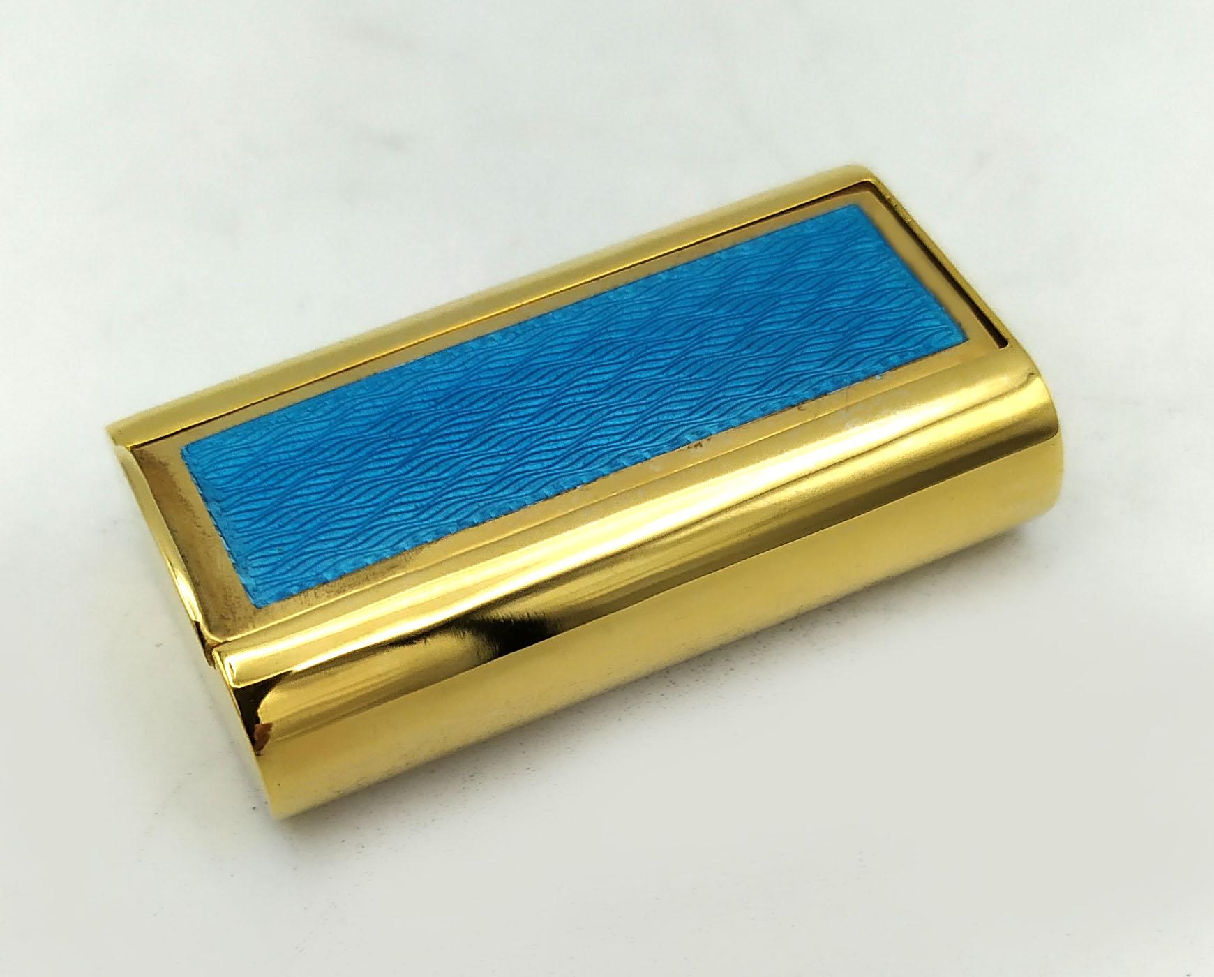 Pill Box Silver is in 925/1000 sterling silver gold plated 24carats.
Pill Box Silver has light blue translucent fired enamels on guilloché.
Pill Box Silver has a sliding lid and hole underneath, for sweetener or other pills.
Pill Box Silver Sterling