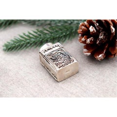 Pill box with filigree reliefs