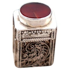 Pill box with filigree reliefs