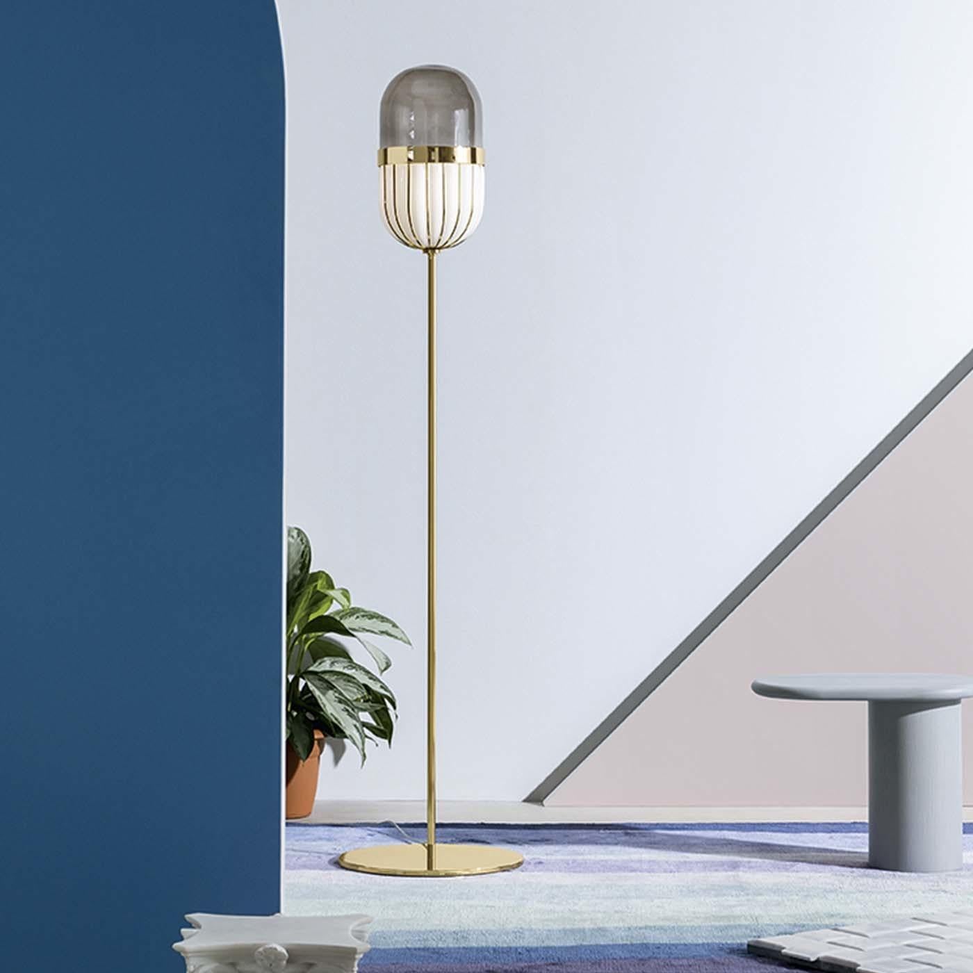 Designed by Matteo Zorzenoni and part of the Pill collection, named after the striking shape of the shade, this floor lamp is an elegant object of functional decor that will imbue with sophistication a modern interior. The metal structure with a