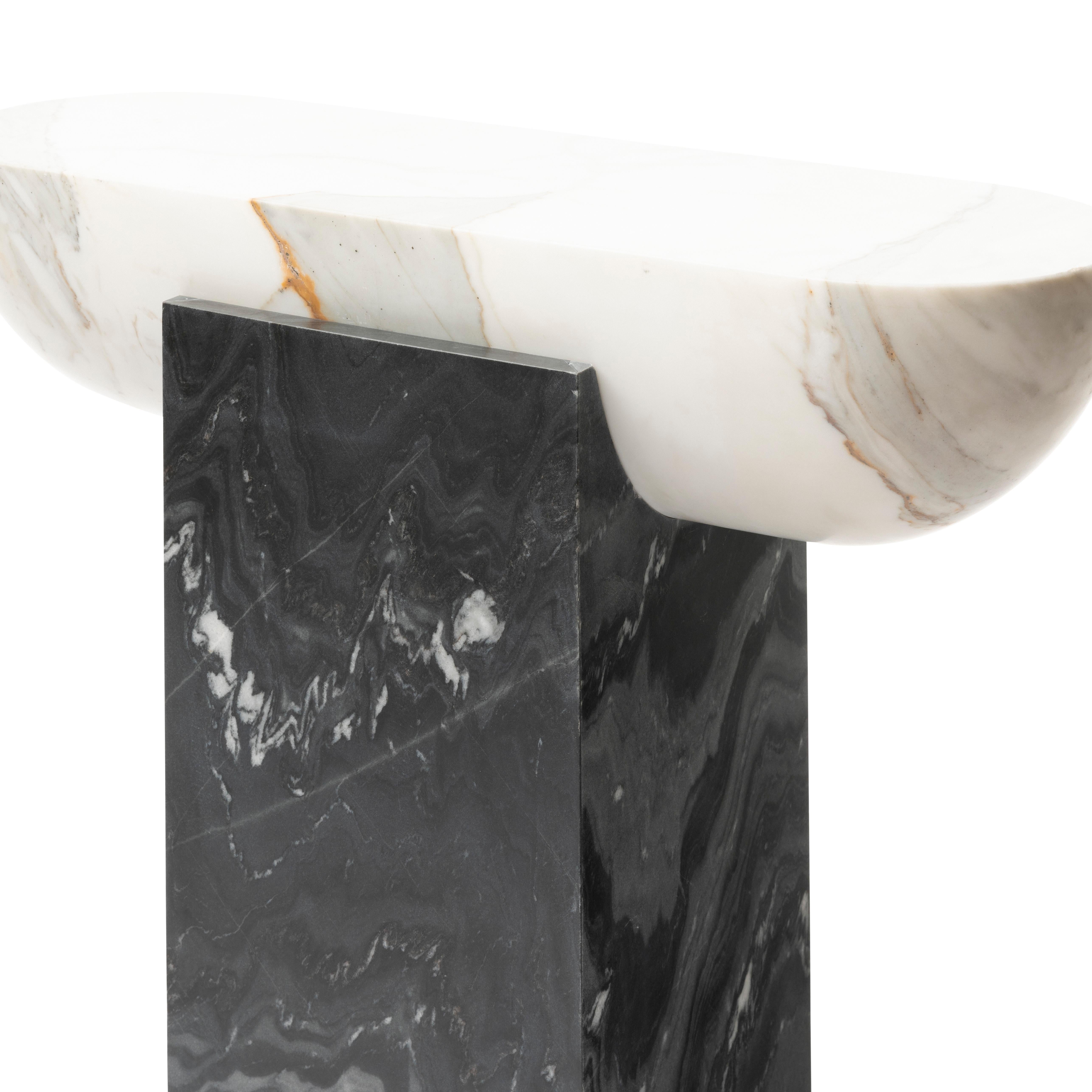 Honed Italian Calacatta marble cupped by a Nero Colonnata plinth; the PILL’S charm is in the justice of its proportions, and the vibrations of its materials.  Intentionally slender, the PILL's silhouette allows it to make a statement in the