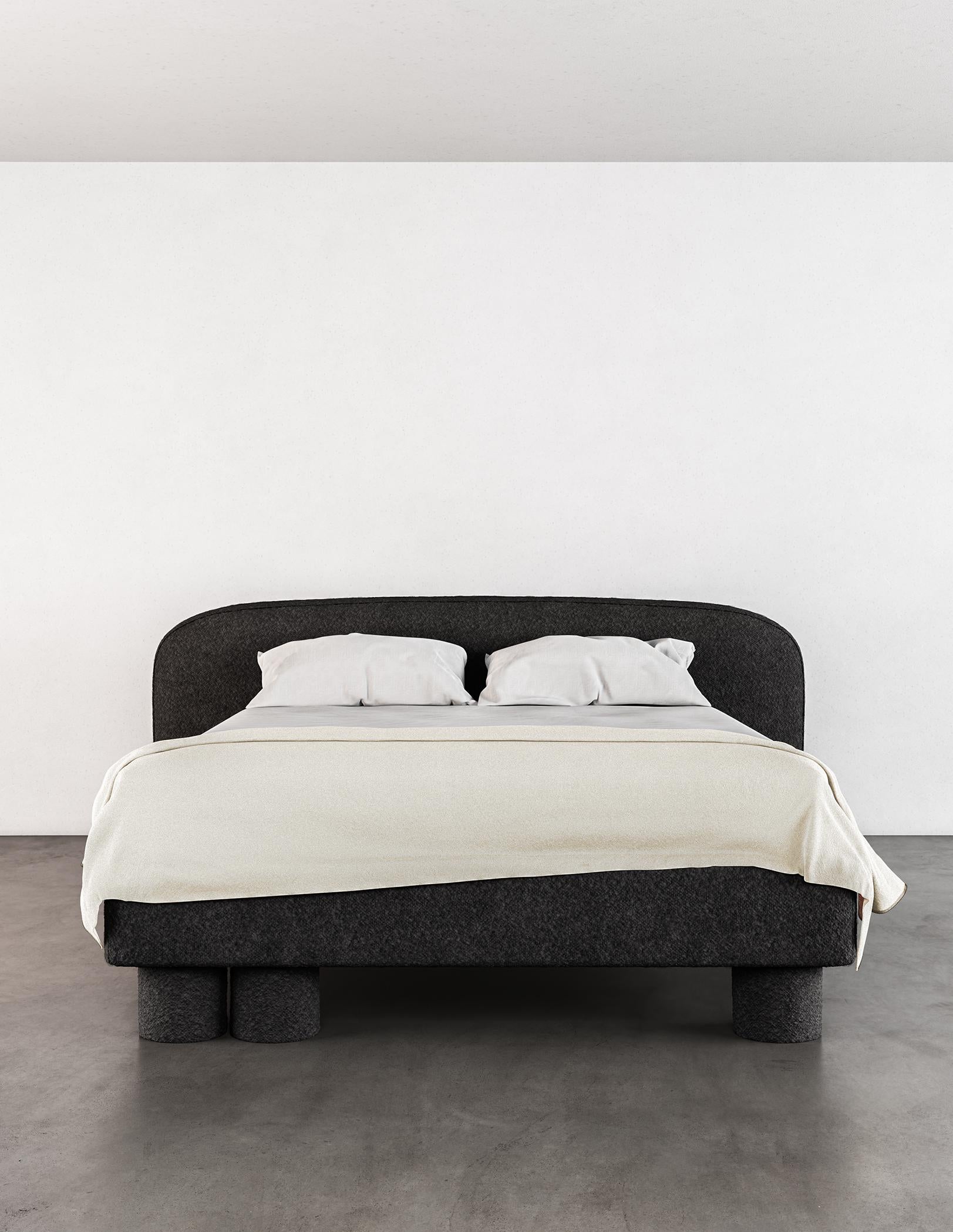 The Pillar Bed is a stunning piece of furniture that boasts a unique and captivating design. It is characterized by layered, asymmetrical design elements that create a sense of sophistication and simplicity. The deliberate imbalance in these design