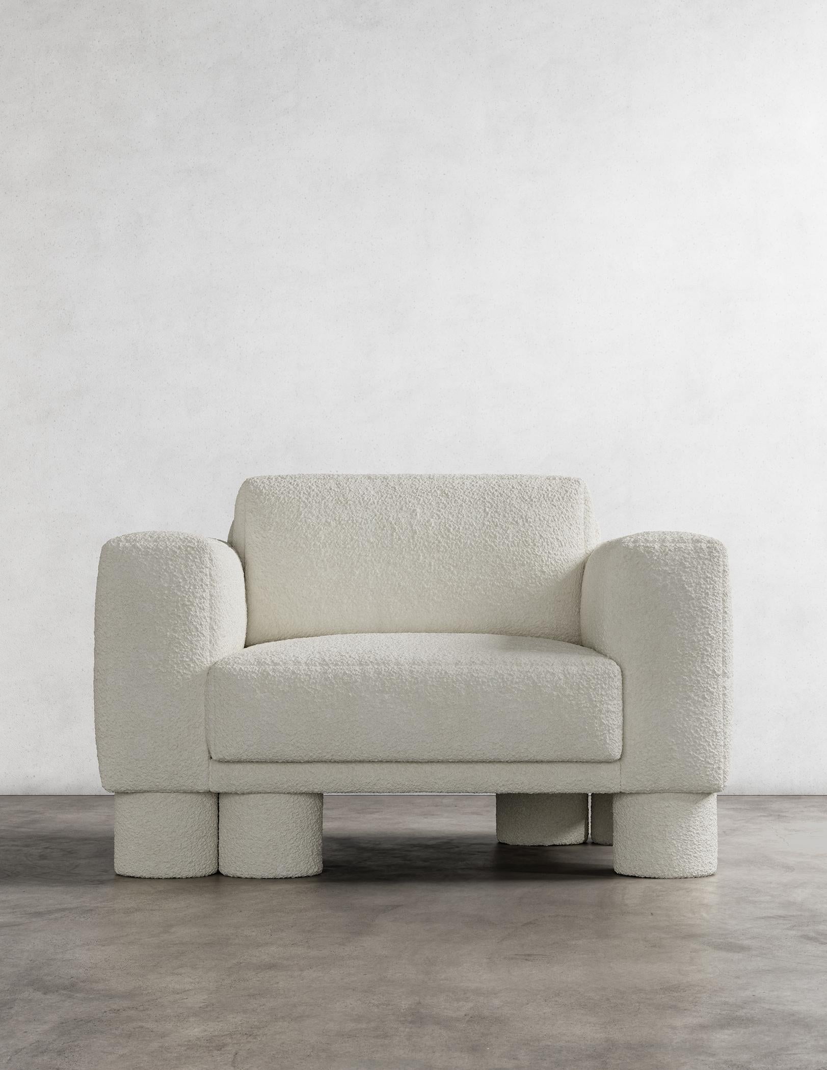 The Pillar Chair is a stunning piece of furniture with a unique and captivating design. It is characterized by layered, asymmetrical design elements that create a sense of sophistication and simplicity. The deliberate imbalance in these design