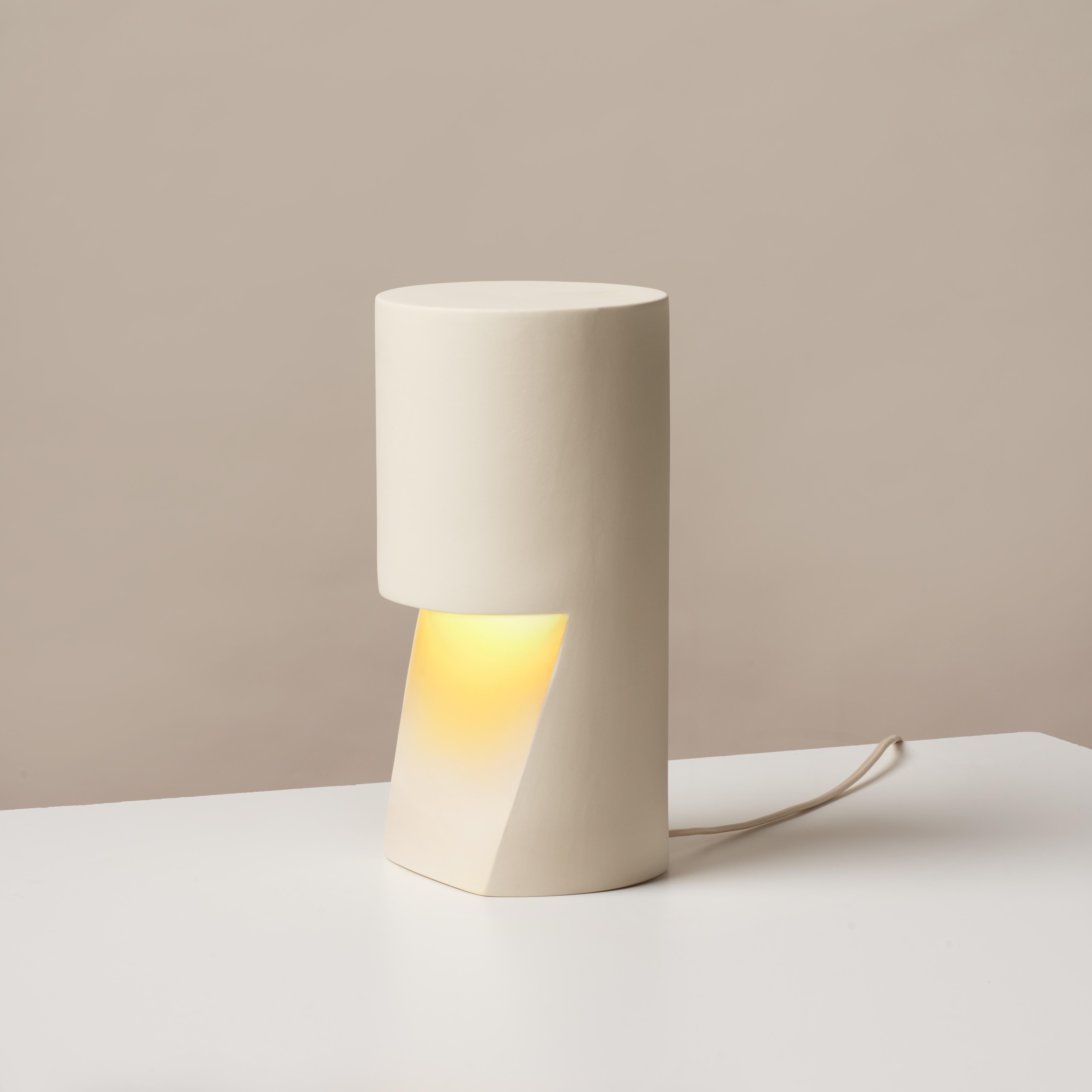 Pillar light by Dust and Form
Dimensions: D 15.2 x 29.2 H cm
Materials: porcelain

Origin Form Collection in three finishes: Hand-sanded (our classic, smooth, bare finish) Ivory (satin white glaze) Charcoal (matte black glaze).

Hand sanded