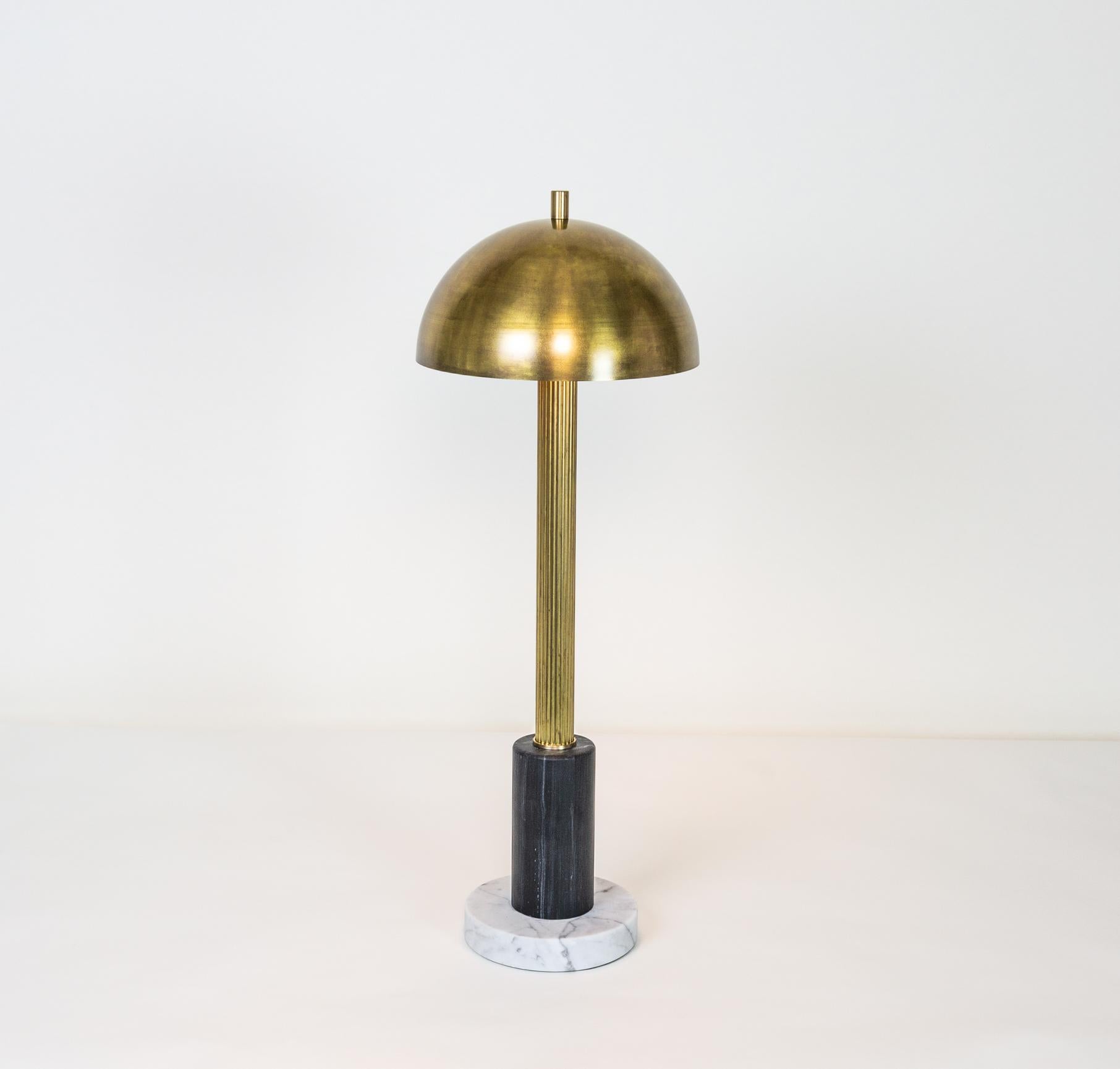 Pillar is a table lamp by Kalin Asenov. Black and white marble base, fluted column, supporting a brass dome. Antique brass, lacquer finish. The table lamp is part of the Meridian series including a ceiling pendants and a sconce listed on