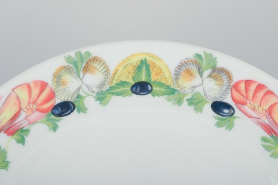 French Pillivuyt, France.  Four large dinner plates in porcelain with seafood motif For Sale