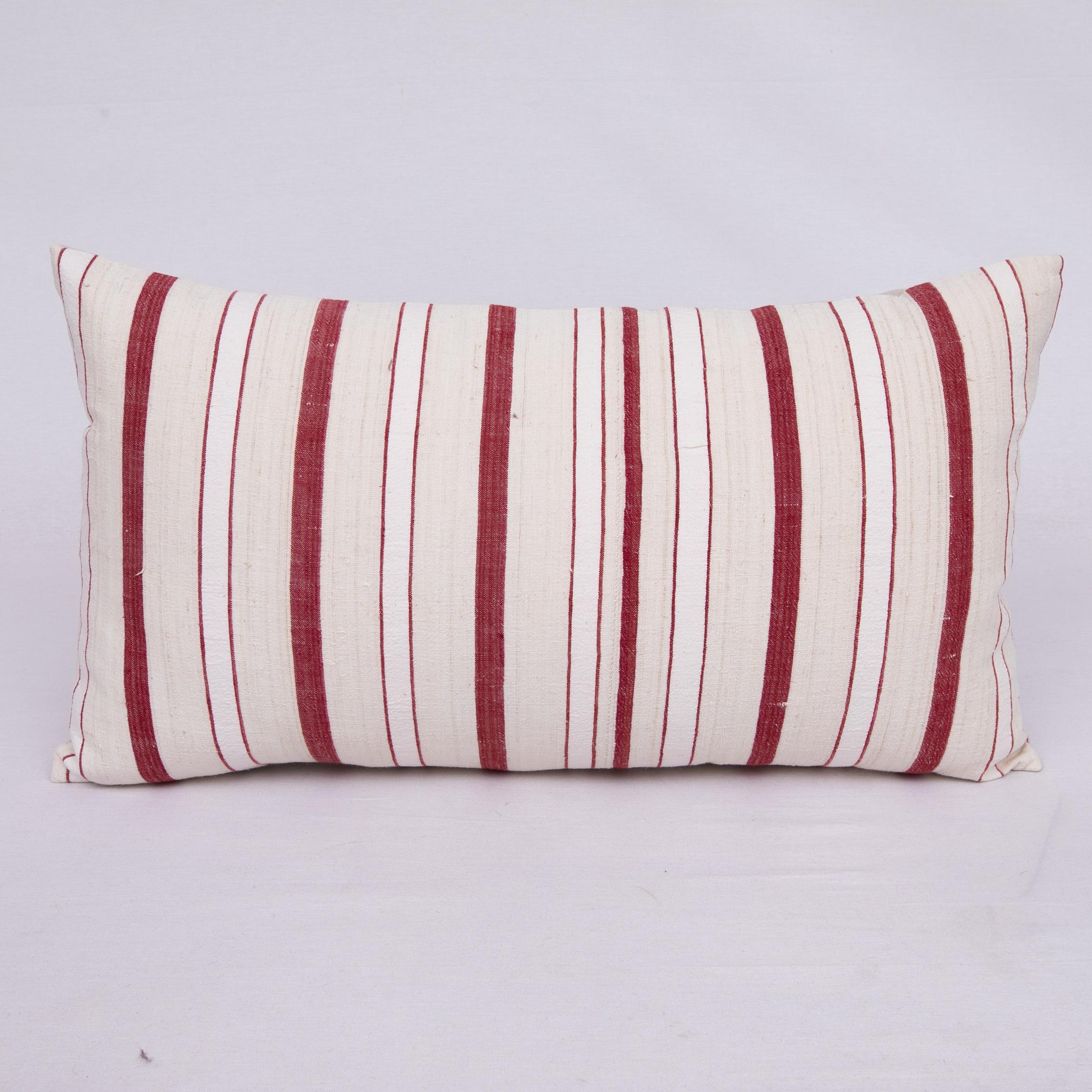 Pillow cover is made from a hand woven cotton fabric, woven in Anatolia, Turkey.
It does not come with an insert.
Cotton in the back.
Zipper closure.
Dry clean is recommended.
  