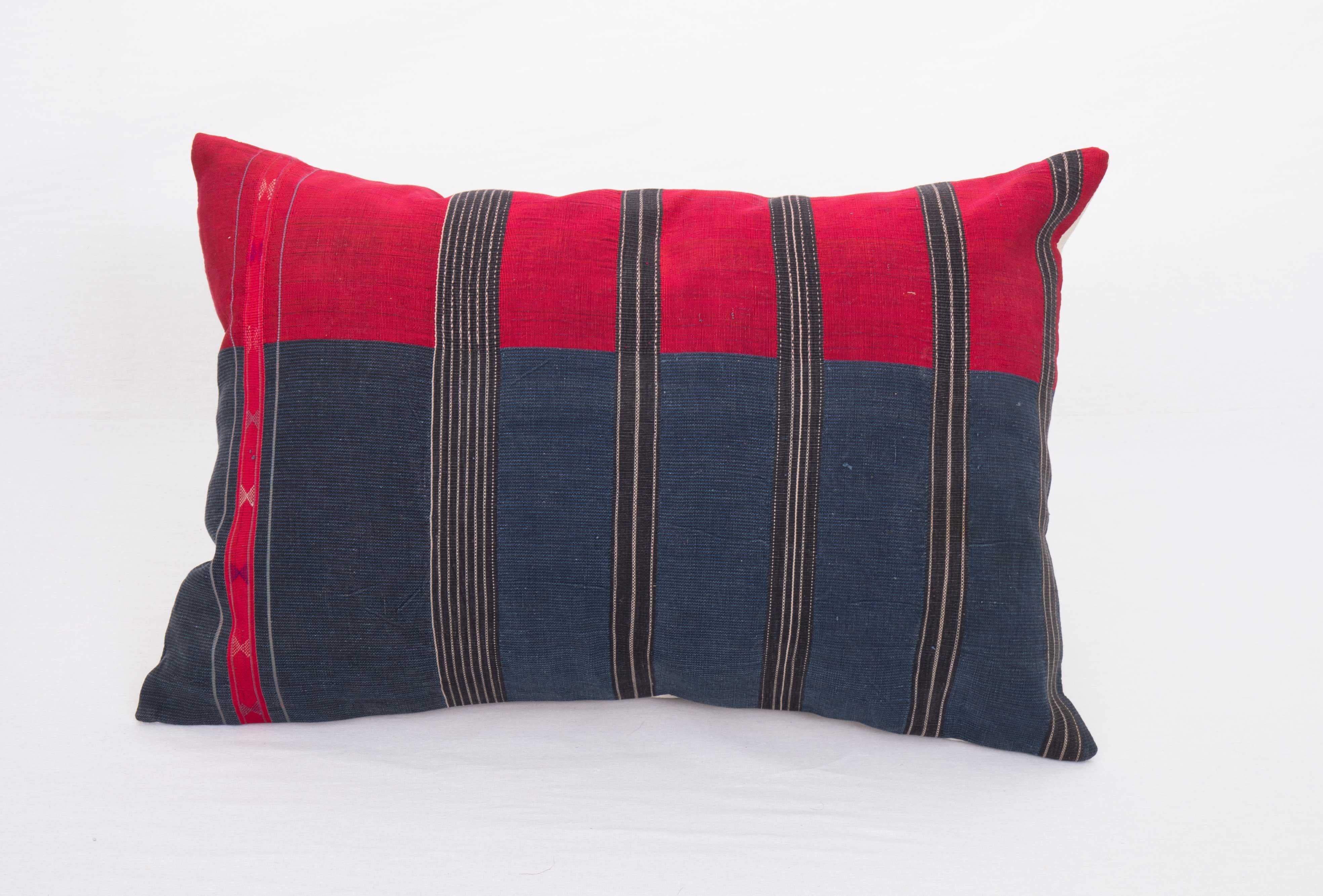 Waziristan is in between Afghanistan and Pakistan as a geographical location. Waziri shawls are generally indigo blue in cotton areas and silk in coloured ares.

This pillowcase is fashioned from an early 20th C. exapmle , the red section is in
