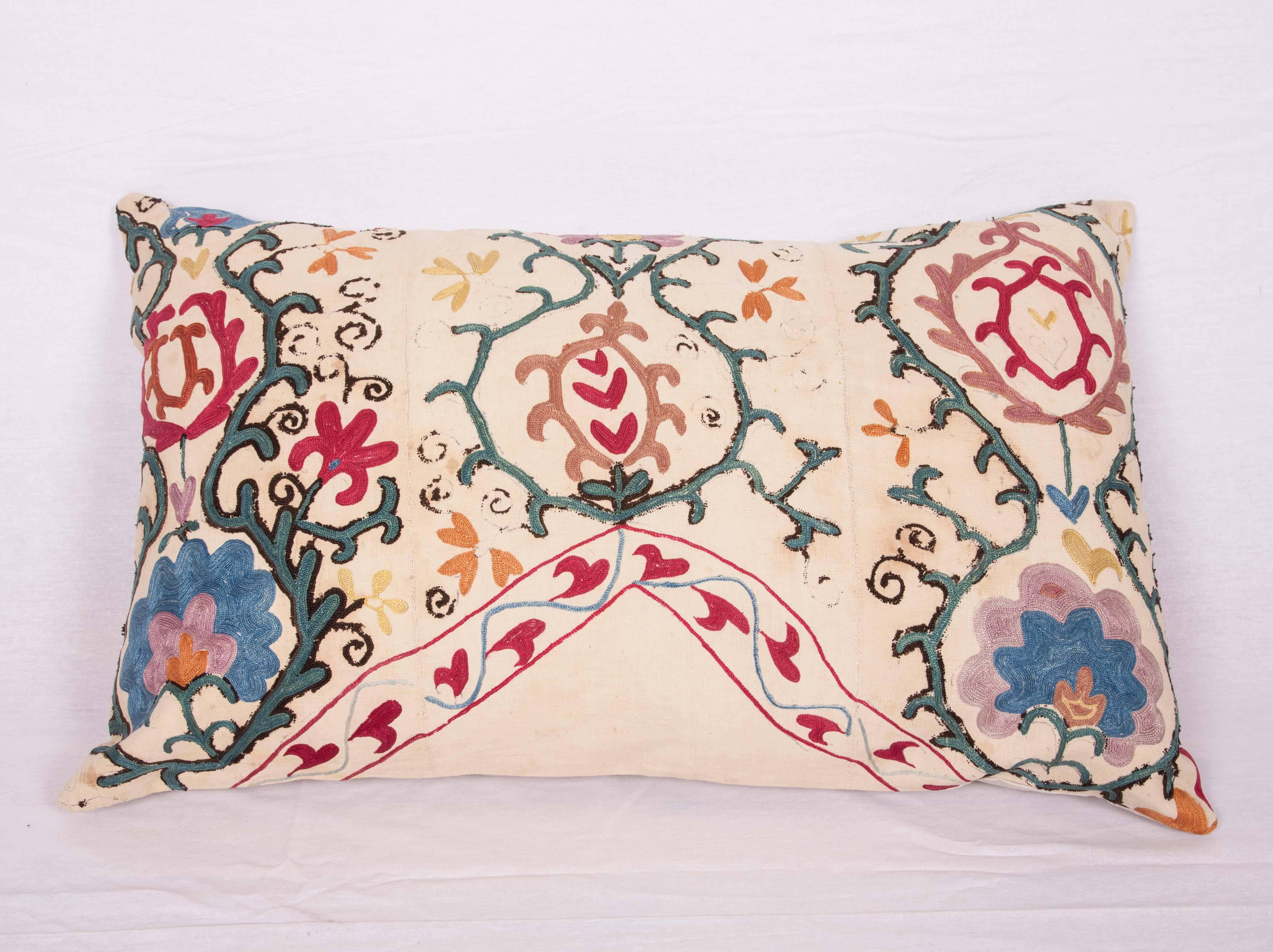 The pillow is made out of a late 19th century, Uzbek Bukhara Suzani. It does not come with an insert but it comes with a bag made to the size and out of cotton to accommodate the filling. The backing is made of linen. Please note 'filling is not